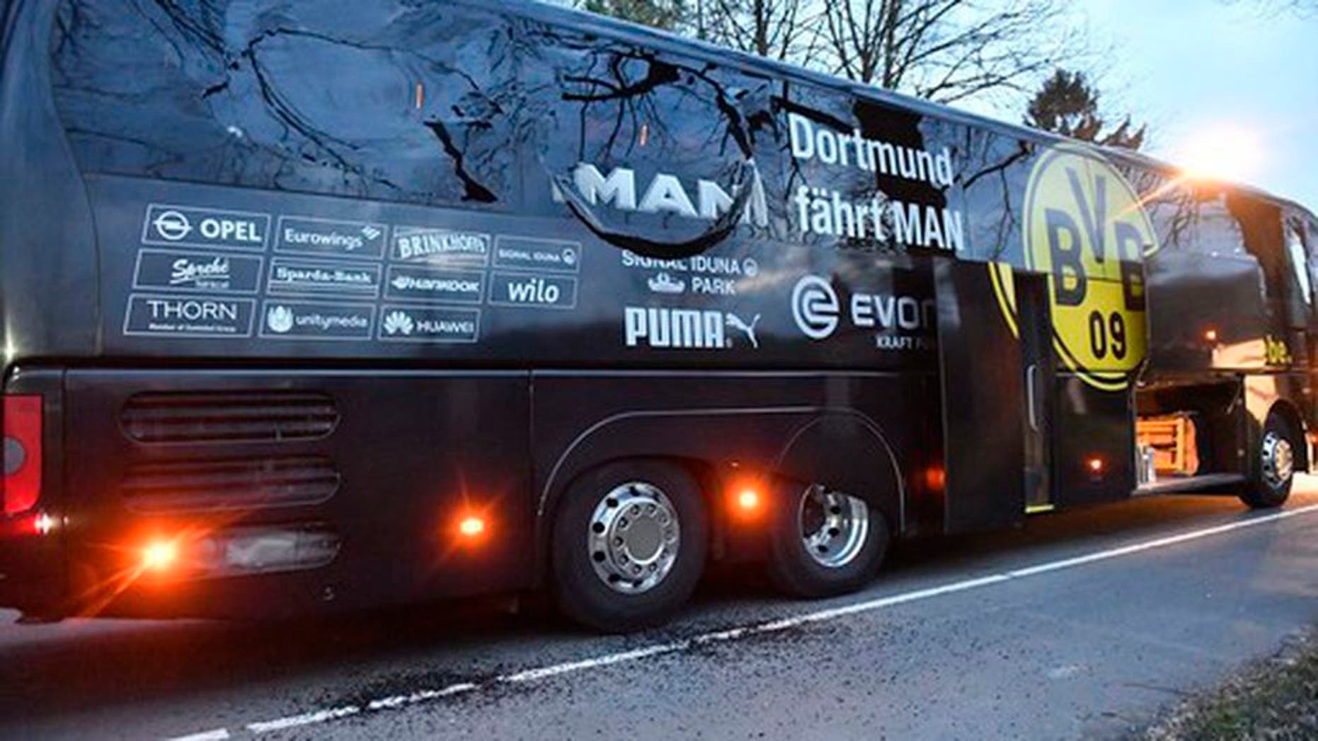 A window of Dortmund's team bus is damaged after an explosion before the Champions League quarterfinal soccer match between Borussia Dortmund and AS Monaco in Dortmund, western Germany, Tuesday, April 11, 2017. (AP Photo/Martin Meissner)