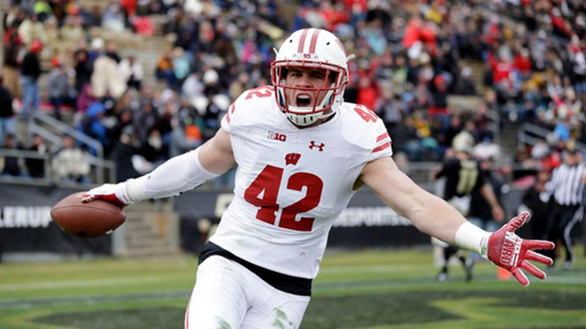 FILE - This Nov. 19, 2016, file photo shows Wisconsin linebacker T.J. Watt (42) celebrating after returning an interception for a touchdown during the first half of an NCAA college football game against the Purdue in West Lafayette, Ind. Frame to grow into a full-time defensive end, but not necessarily the athleticism to be an elite rusher. Last quarter of the first round. (AP Photo/Michael Conroy, File)