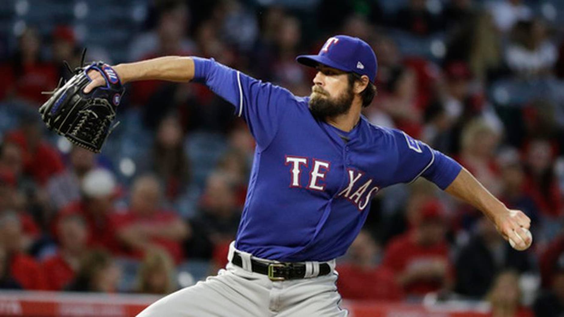 Texas Rangers starting pitcher Cole Hamels throws against the Los Angeles Angels during the first inning of a baseball game, Tuesday, April 11, 2017, in Anaheim, Calif. Cole Hamels makes his fourth start this season for Texas on Friday, April 21,, and the Rangers left-hander is still looking for his first decision when the Rangers host Kansas City. (AP Photo/Jae C. Hong)