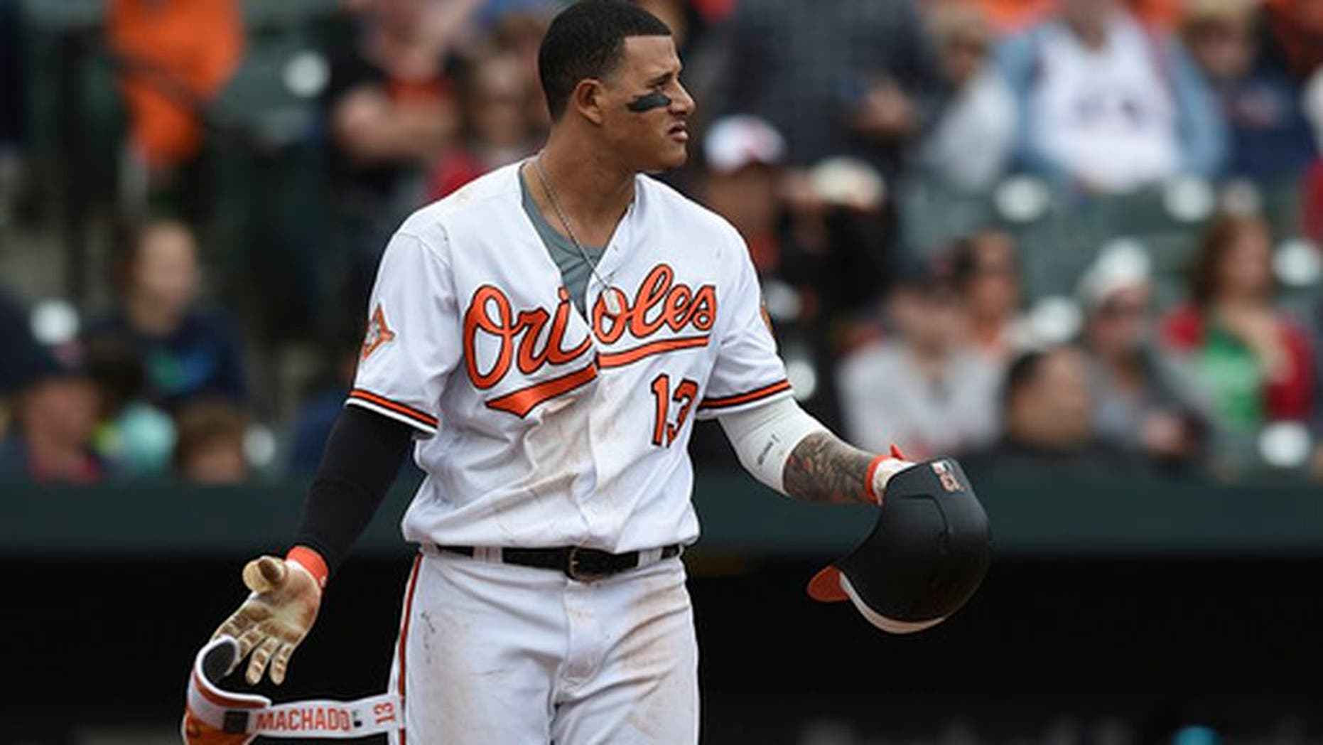 Baltimore Orioles Manny Machado looks to the mound after a pitch was thrown near his head by Boston Red Sox pitcher Matt Barnes during the eighth inning of a baseball game, Sunday, April 23, 2017, in Baltimore. (AP Photo/Gail Burton)