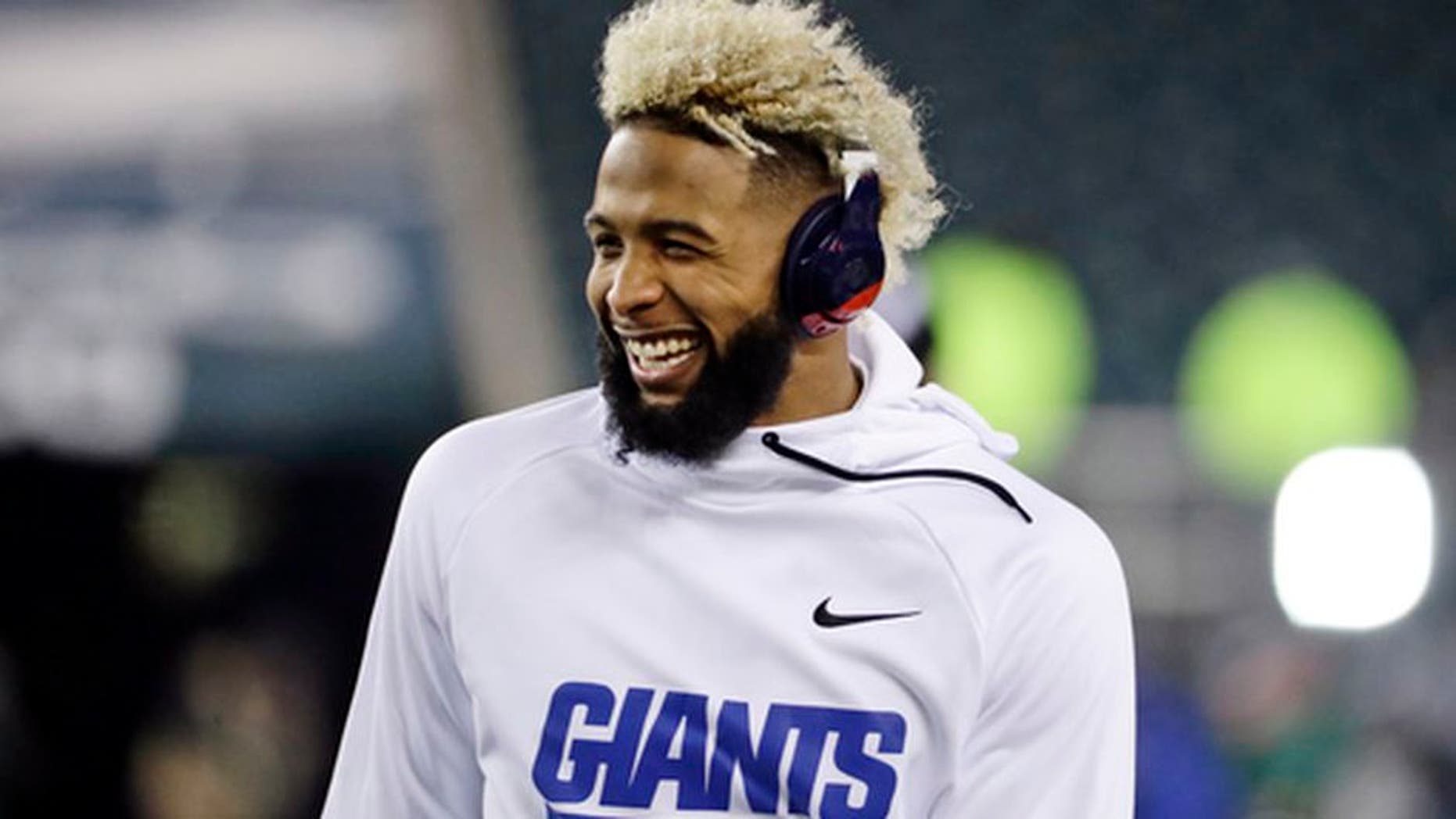 In this Dec. 22, 2016 photo, New York Giants' Odell Beckham smiles before an NFL football game against the Philadelphia Eagles in Philadelphia. The Giants have picked up the fifth-year option on Beckham Jr.'s contract, the team announced Thursday, April 27, 2017. (AP Photo/Michael Perez, File)
