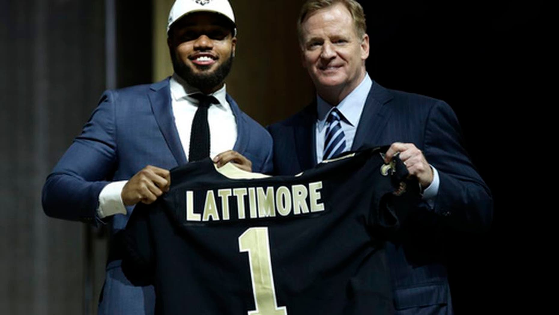 Ohio State's Marshon Lattimore, left, poses with NFL commissioner Roger Goodell after being selected by the New Orleans Saints during the first round of the 2017 NFL football draft, Thursday, April 27, 2017, in Philadelphia. (AP Photo/Matt Rourke)