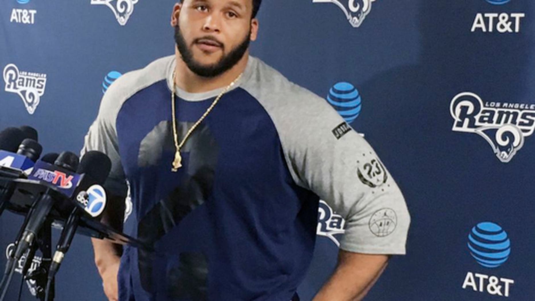 Los Angeles Rams defensive lineman Aaron Donald speaks with reporters after the first official day of the team's offseason football training program, Monday, April 10, 2017, in Thousand Oaks, Calif. (AP Photo/Greg Beacham)