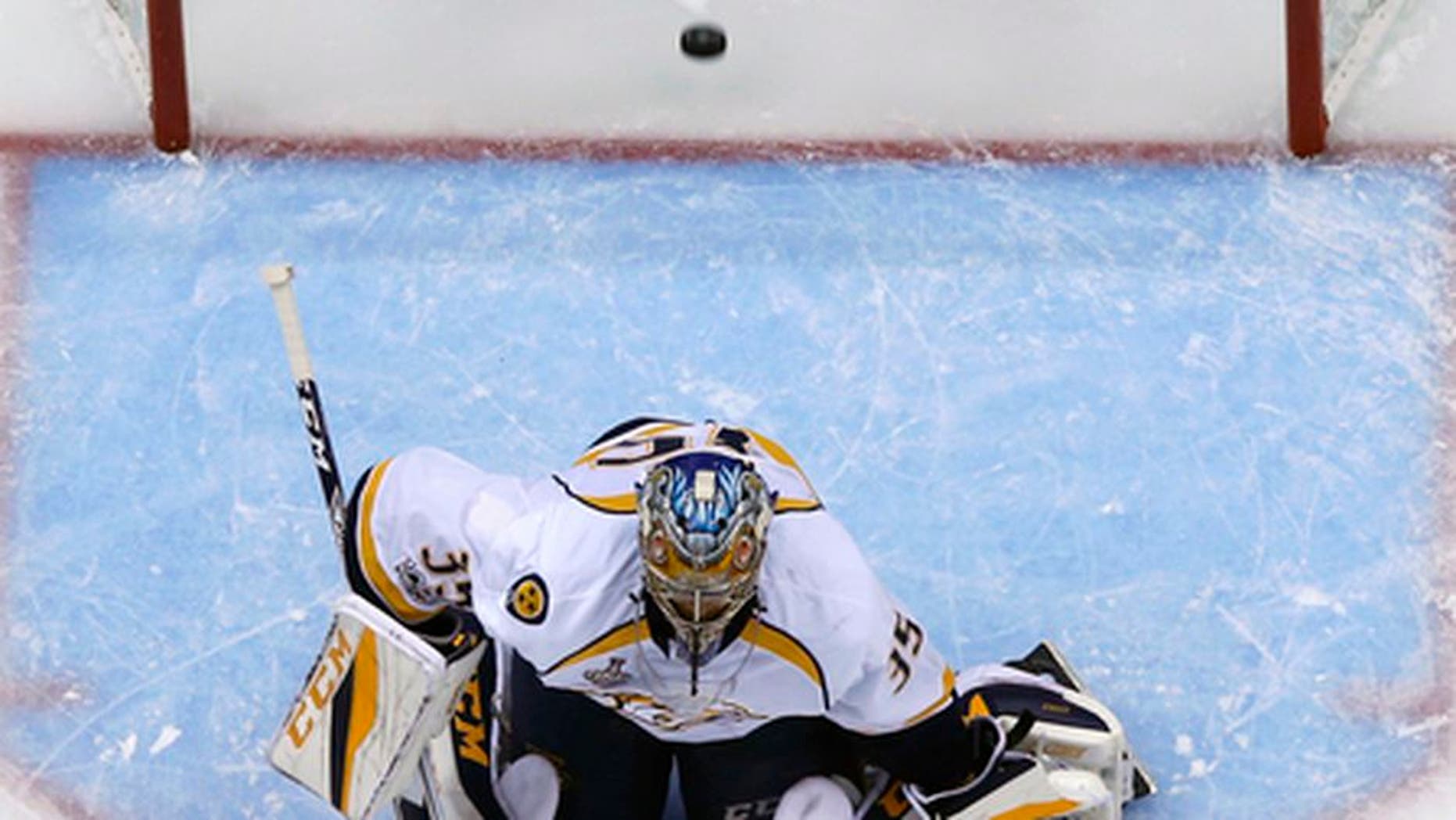 A shot by Pittsburgh Penguins' Justin Schultz gets past Nashville Predators goalie Pekka Rinne (35) for a goal during the first period of Game 5 of the NHL Stanley Cup Final, Thursday, June 8, 2017, in Pittsburgh. (AP Photo/Gene J. Puskar)