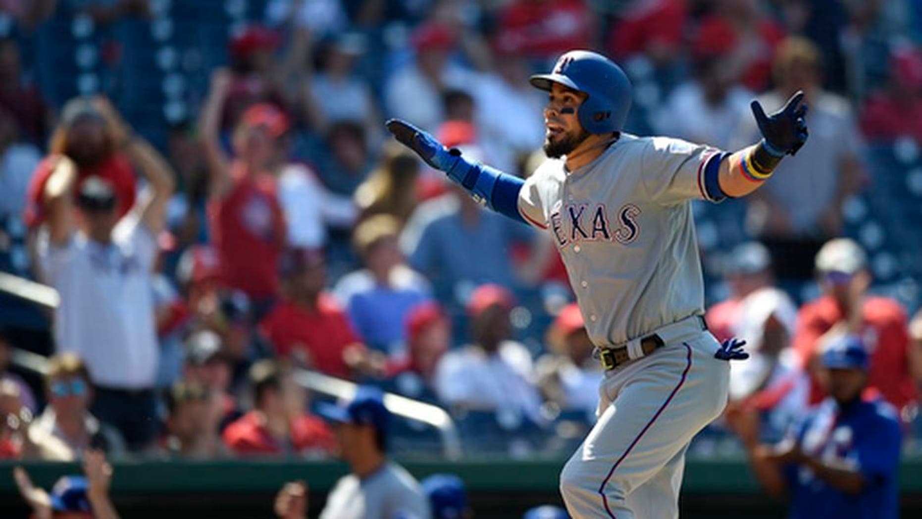 Texas Rangers' Robinson Chirinos reacts as he heads home after he hit a three-run home run during the 11th inning of a baseball game against the Washington Nationals, Saturday, June 10, 2017, in Washington. The Rangers won 6-3 in 11 innings. (AP Photo/Nick Wass)