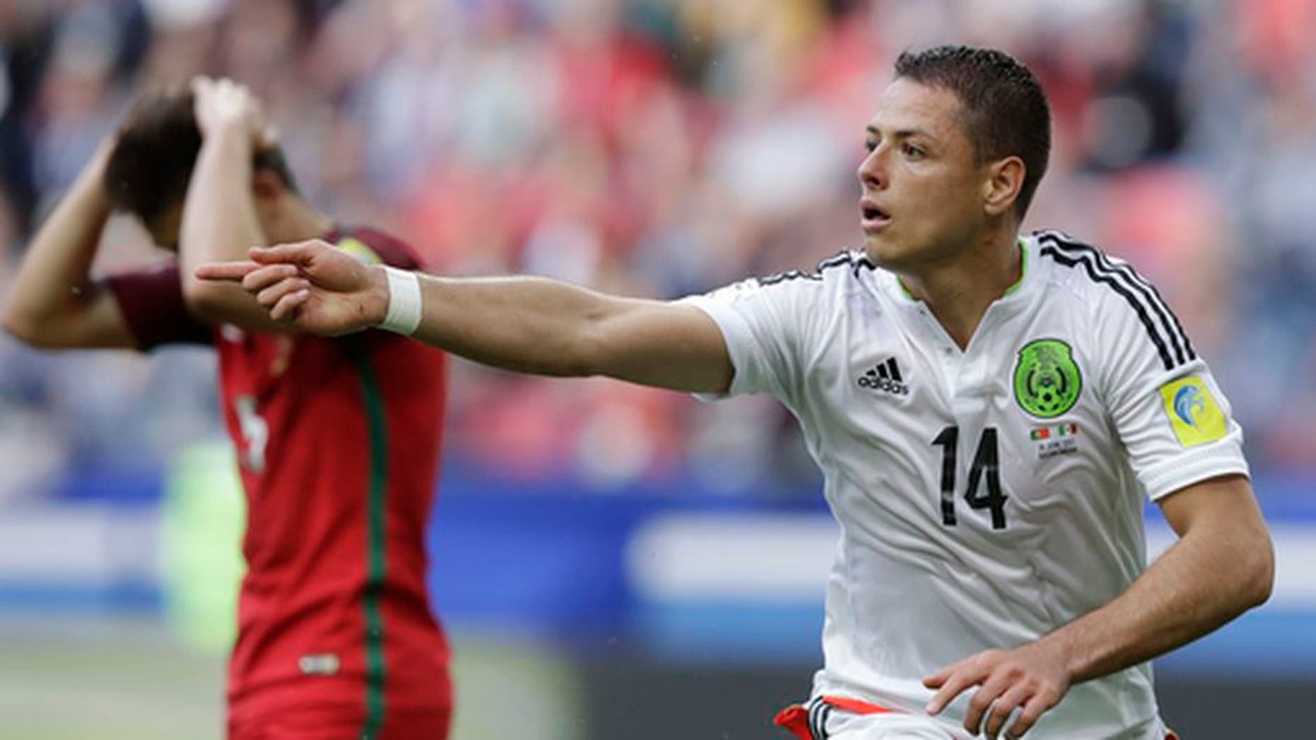 Mexico's Javier Hernandez celebrates after scoring his side's first goal during the Confederations Cup, Group A soccer match between Portugal and Mexico, at the Kazan Arena, Russia, Sunday, June 18, 2017. (AP Photo/Thanassis Stavrakis)