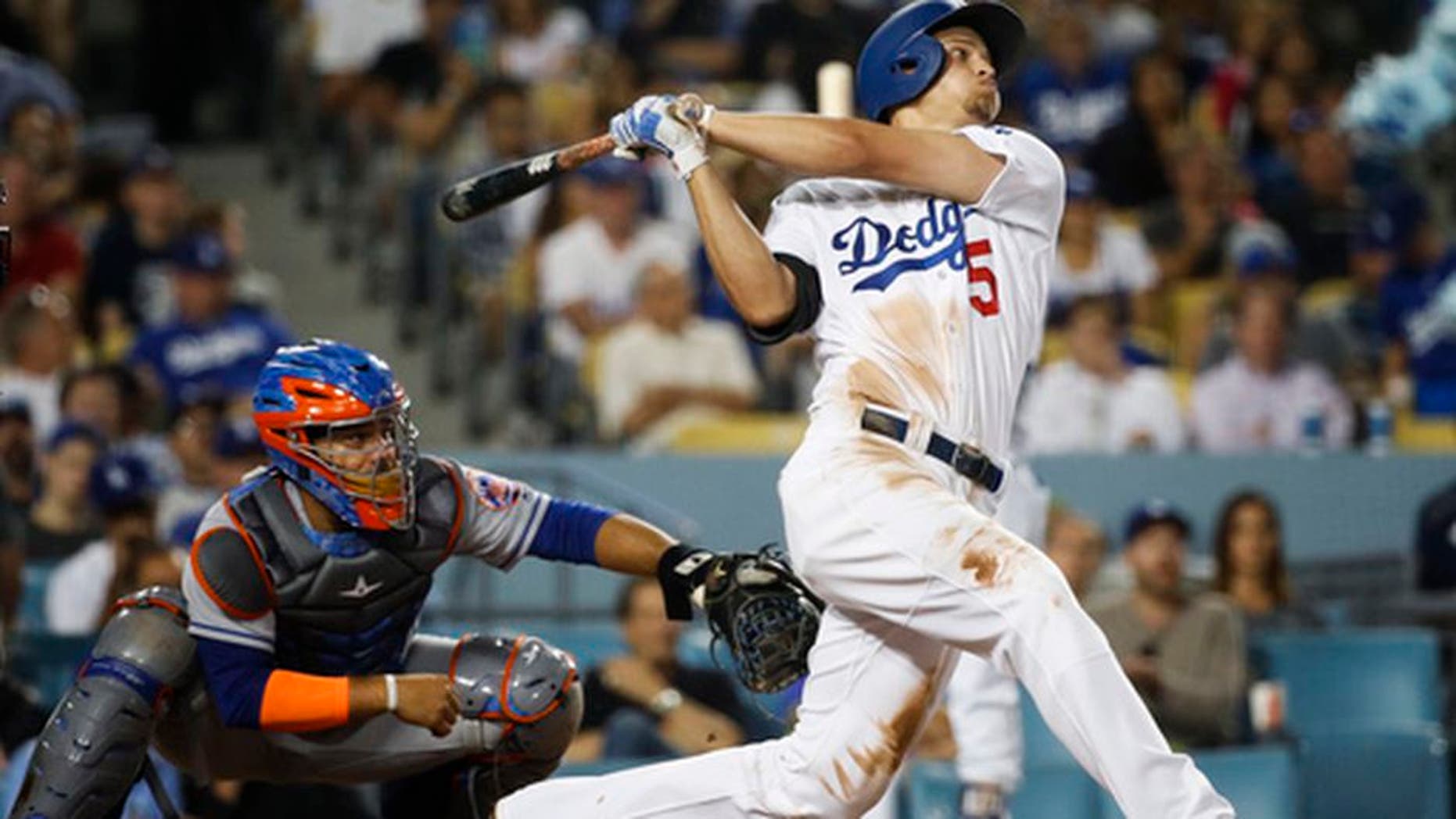 Los Angeles Dodgers' Corey Seager watches his third home run of the night, during the fifth inning of the team's baseball game against the New York Mets, Tuesday, June 20, 2017, in Los Angeles. (AP Photo/Jae C. Hong)