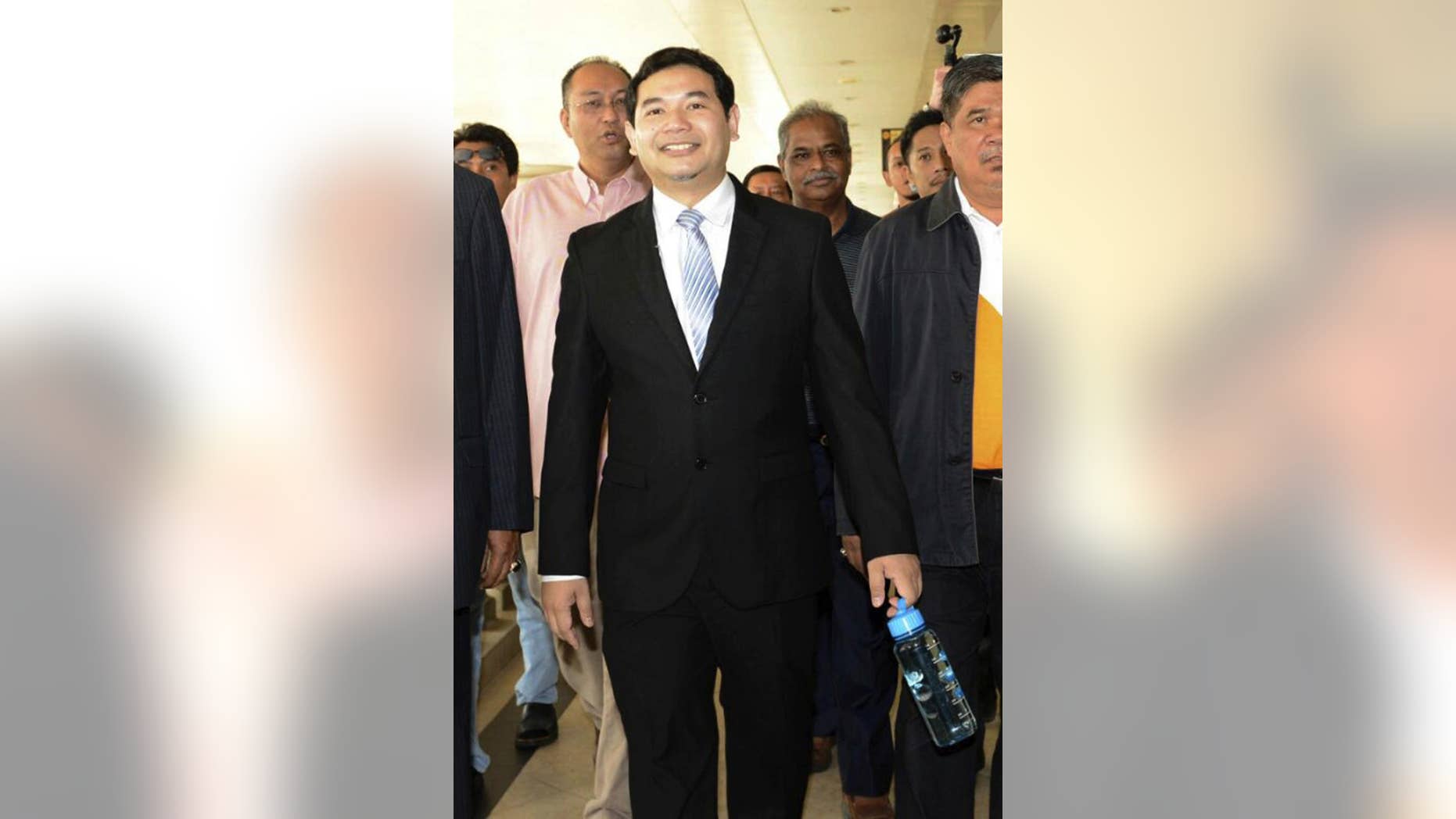 Malaysia's People's Justice Party Vice President Rafizi Ramli arrives at court in Kuala Lumpur, Malaysia, Monday, Nov. 14, 2016. The prominent Malaysian opposition lawmaker, who has a reputation as a whistle blower, has been sentenced to 18 months in jail for releasing a classified document on a controversial state investment fund, founded by Prime Minister Najib Razak. (AP Photo)