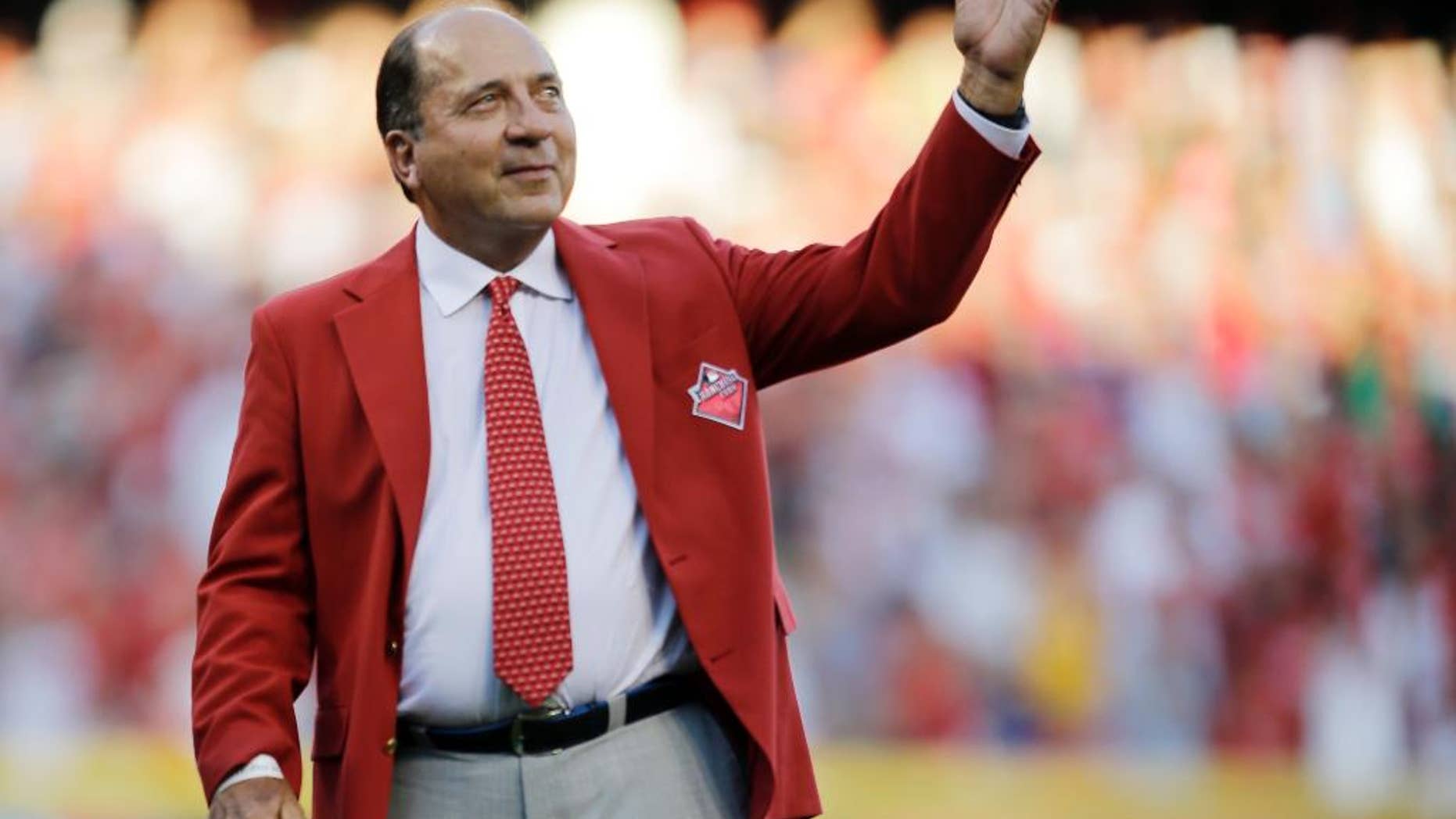 FILE - In this July 14, 2015 file photo, Johnny Bench is introduced as one of the Cincinnati Reds Franchise Four before the MLB All-Star baseball game, in Cincinnati. Major League Baseball Hall of Famer Bench has launched a new cellphone app aimed at combatting bullying in schools nationwide. The Cincinnati Reds catcher officially launched his "Smithfield School App" on Thursday, Nov. 17, 2016, at the Montgomery Inn Boathouse in downtown Cincinnati. (AP Photo/Jeff Roberson, File)