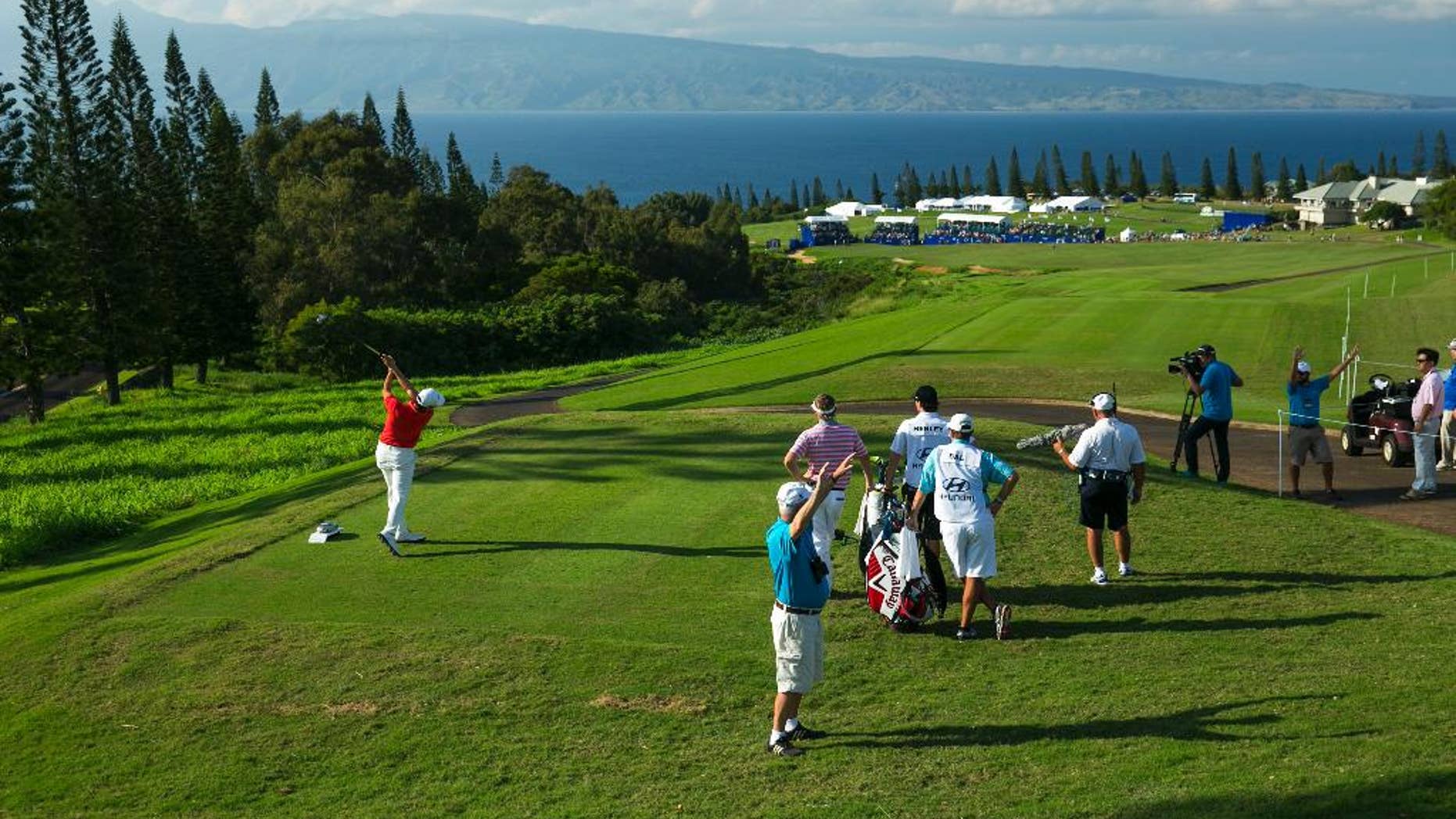 Sang-Moon Bae, of South Korea, drives on the 18th tee during the third round of the Tournament of Champions golf tournament, Sunday, Jan. 11, 2015, in Kapalua, Hawaii. (AP Photo/Marco Garcia)