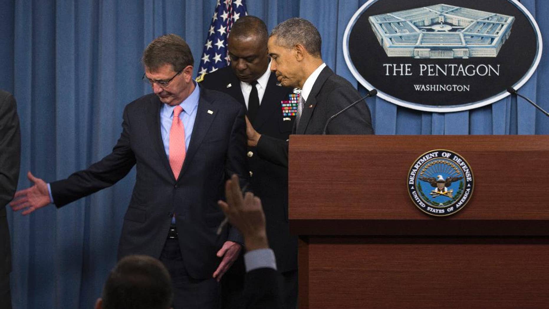 President Barack Obama, Defense Secretary Ash Carter and Commander of U.S. Central Command Gen. Lloyd Austin, leave the podium after the president spoke at the Pentagon, Monday, Dec. 14, 2015, about the fight against the Islamic State group following a National Security Council meeting. The president said the U.S. military and allied forces are hitting the Islamic State group harder than ever. (AP Photo/Evan Vucci)