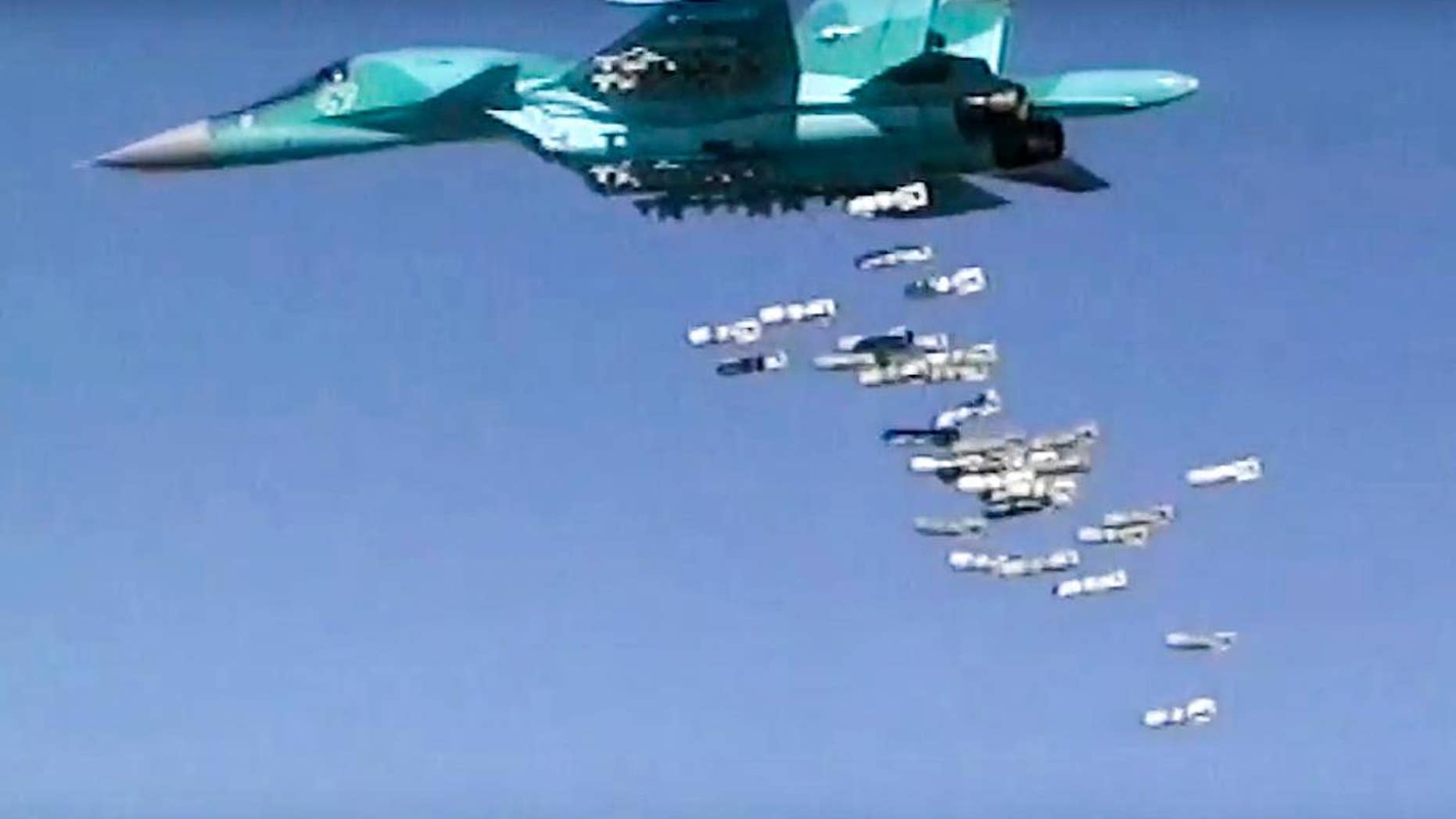 In this frame grab provided by Russian Defence Ministry press service shows a Russian combat fighter bomber Su-34 flies during an air strike over Syria on Thursday, Aug. 18, 2016. The Russian defense ministry said in a statement Friday it never targets populated areas and that rebels themselves hit urban areas in order to derail humanitarian efforts there. (Russian Defence Ministry Press Service photo via AP)