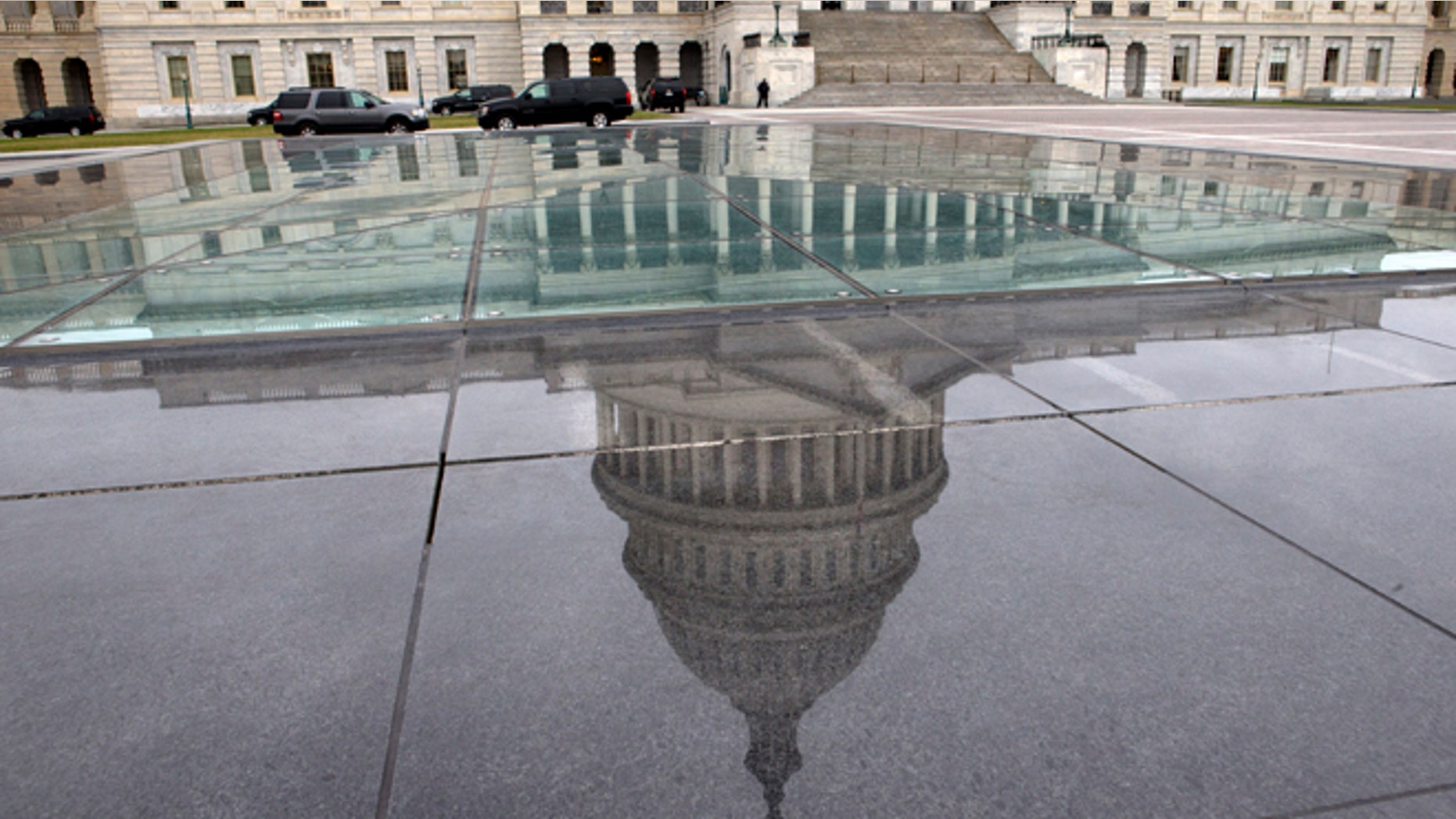FILE - In this Tuesday, Jan. 1, 2013, file photo, the dome of the Capitol is reflected in a skylight of the Capitol Visitor's Center in Washington.