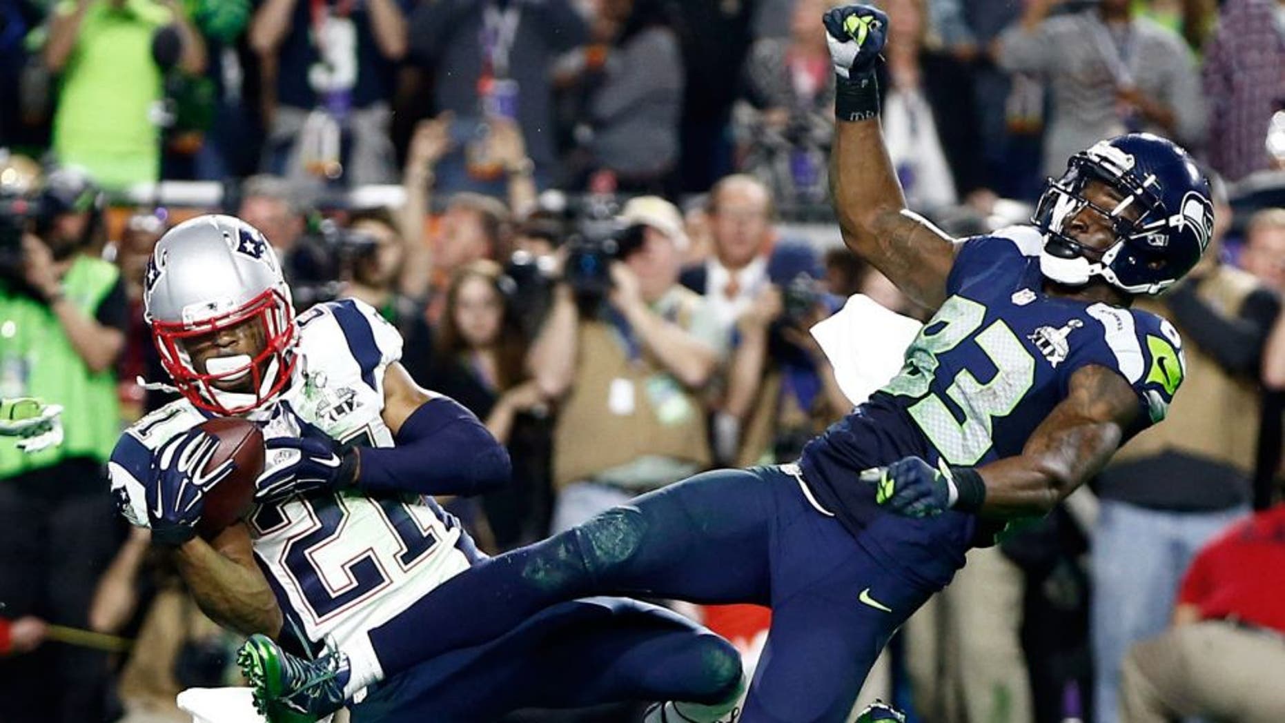 Feb 1, 2015; Glendale, AZ, USA; New England Patriots strong safety Malcolm Butler (21) intercepts a pass intended for Seattle Seahawks wide receiver Ricardo Lockette (83) in the fourth quarter in Super Bowl XLIX at University of Phoenix Stadium. Mandatory Credit: Mark J. Rebilas-USA TODAY Sports
