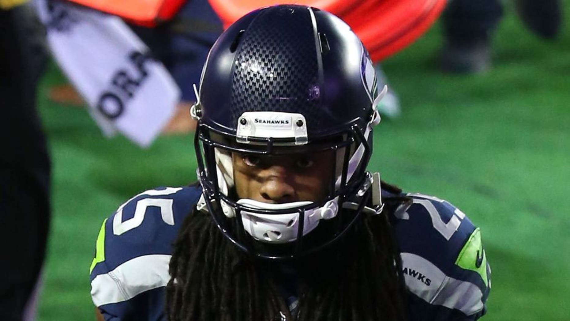GLENDALE, AZ - FEBRUARY 01: Richard Sherman #25 of the Seattle Seahawks looks dejected after defeat to the New England Patriots Super Bowl XLIX at University of Phoenix Stadium on February 1, 2015 in Glendale, Arizona. The Patriots defeated the Seahawks 28-24. (Photo by Andy Lyons/Getty Images)