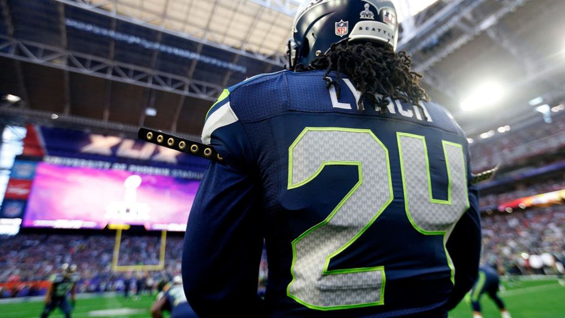 GLENDALE, AZ - FEBRUARY 01: Marshawn Lynch #24 of the Seattle Seahawks stands on the field prior to Super Bowl XLIX at University of Phoenix Stadium on February 1, 2015 in Glendale, Arizona. (Photo by Christian Petersen/Getty Images)