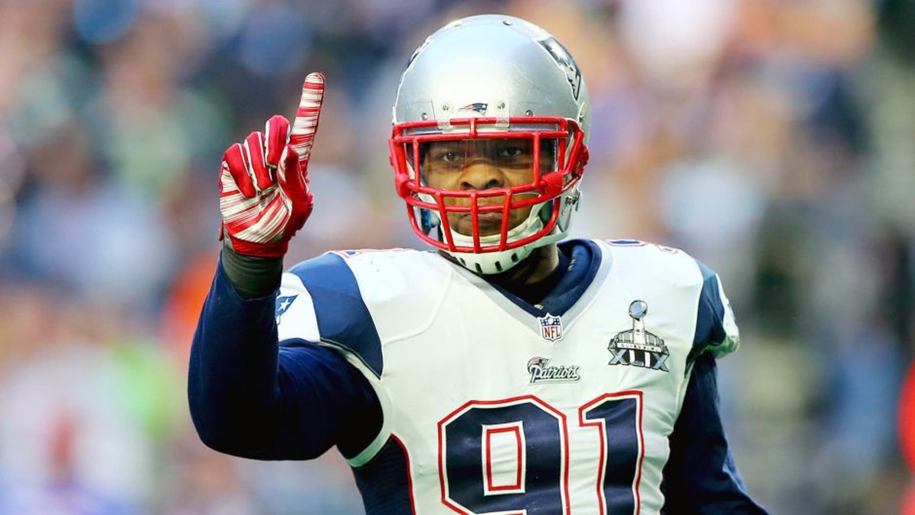 Jamie Collins #91 of the New England Patriots reacts after stopping Marshawn Lynch #24 of the Seattle Seahawks in the first quarter during Super Bowl XLIX at University of Phoenix Stadium on February 1, 2015 in Glendale, Arizona. (Photo by Elsa/Getty Images)