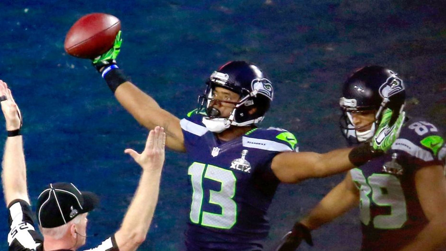 Chris Matthews #13 of the Seattle Seahawks celebrates scoring an 11 yard touchdown late in the second quarter with Doug Baldwin #89 against the New England Patriots during Super Bowl XLIX at University of Phoenix Stadium on February 1, 2015 in Glendale, Arizona. (Photo by Jamie Squire/Getty Images)