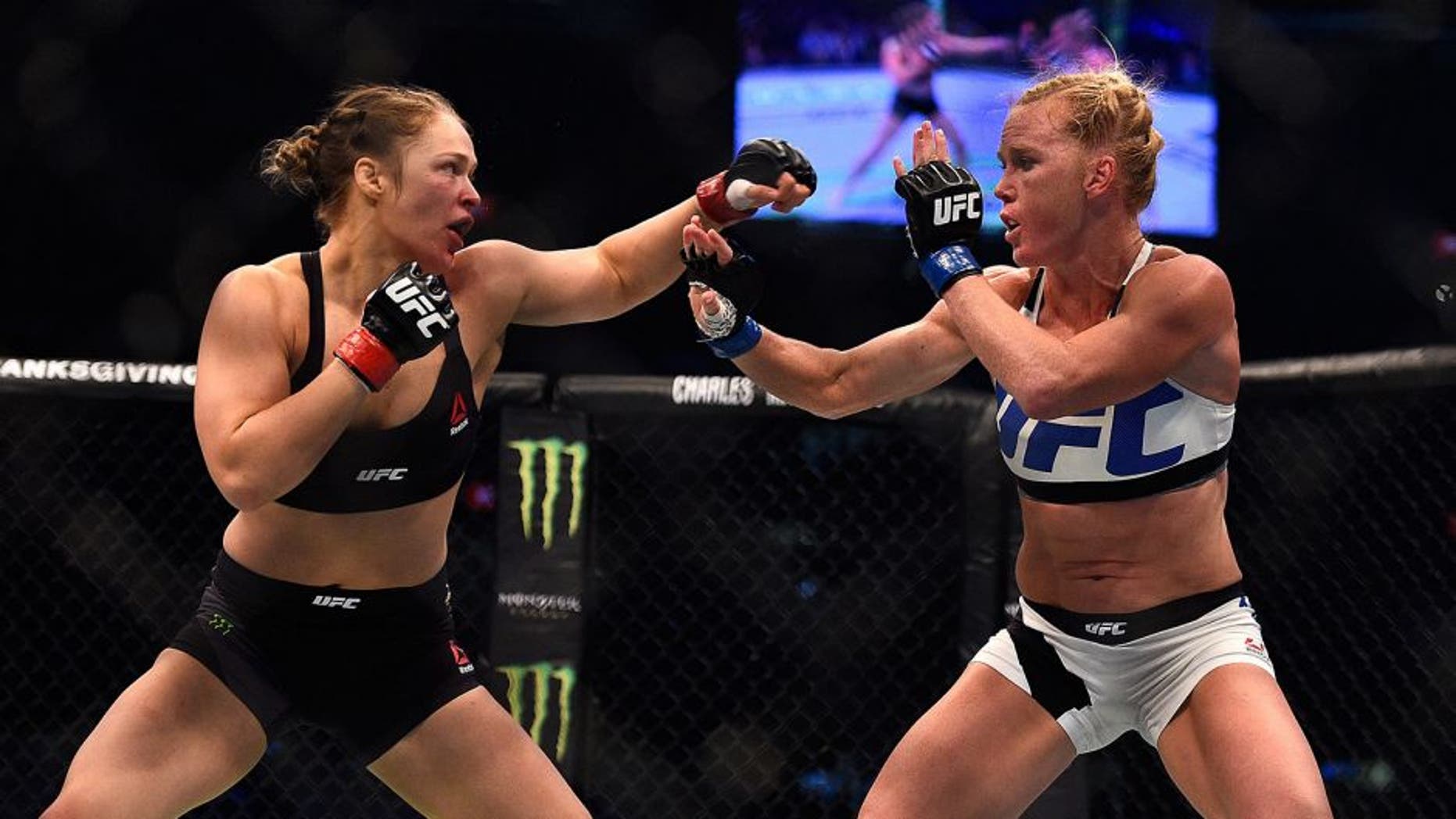 MELBOURNE, AUSTRALIA - NOVEMBER 15: (L-R) Ronda Rousey faces Holly Holm in their UFC women's bantamweight championship bout during the UFC 193 event at Etihad Stadium on November 15, 2015 in Melbourne, Australia. (Photo by Jeff Bottari/Zuffa LLC/Zuffa LLC via Getty Images)