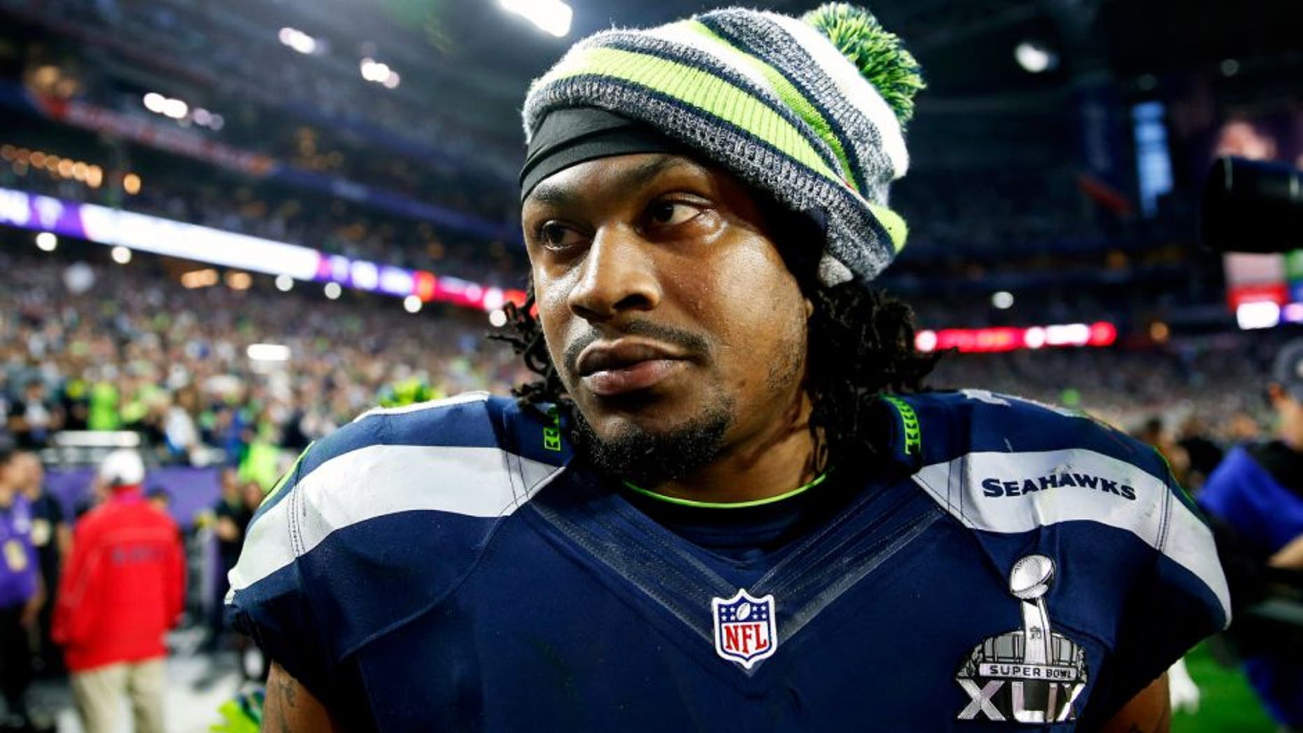 GLENDALE, AZ - FEBRUARY 01: Marshawn Lynch #24 of the Seattle Seahawks walks off the field at half time during Super Bowl XLIX at University of Phoenix Stadium on February 1, 2015 in Glendale, Arizona. (Photo by Christian Petersen/Getty Images)