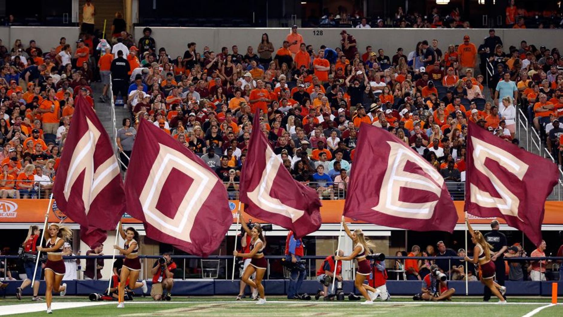 Aug 30, 2014; Arlington, TX, USA; The Florida State Seminoles cheerleaders take the field before the start of the third quarter against the Oklahoma State Cowboys at AT&T Stadium. Mandatory Credit: Matthew Emmons-USA TODAY Sports