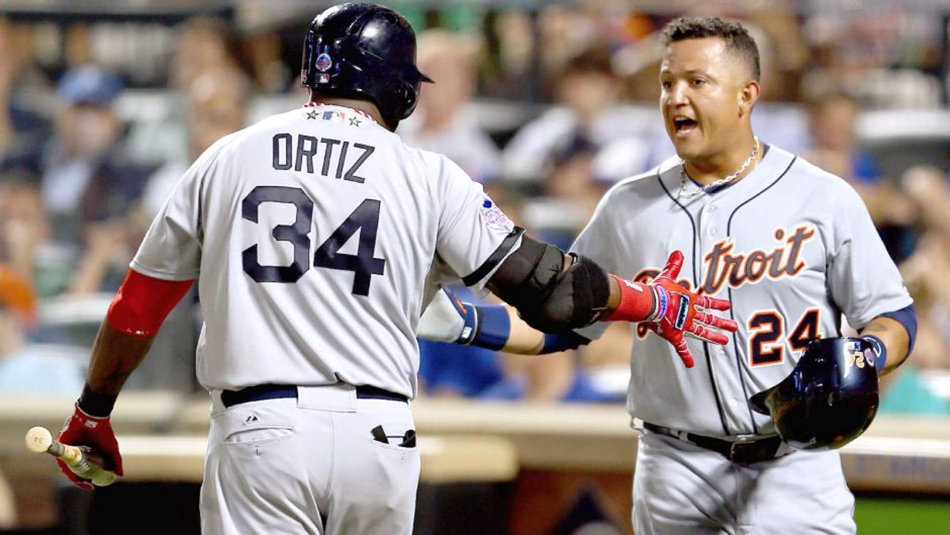 NEW YORK, NY - JULY 16: American League All-Star David Ortiz #34 of the Boston Red Sox greets American League All-Star Miguel Cabrera #24 of the Detroit Tigers after Cabrera scored in the fourth inning during the 84th MLB All-Star Game on July 16, 2013 at Citi Field in the Flushing neighborhood of the Queens borough of New York City. (Photo by Mike Ehrmann/Getty Images)