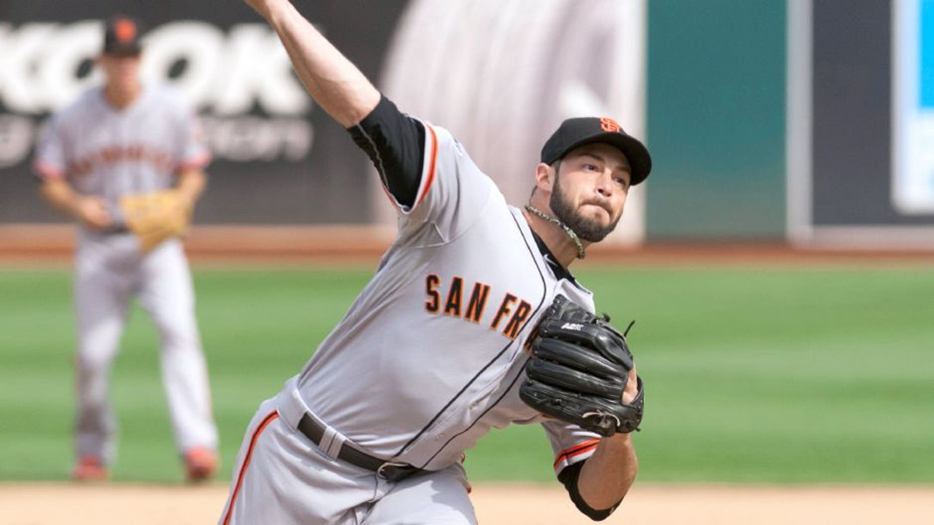 Sep 27, 2015; Oakland, CA, USA; San Francisco Giants relief pitcher George Kontos (70) throws a pitch against the Oakland Athletics during the sixth inning at O.co Coliseum. The San Francisco Giants defeated the Oakland Athletics 5-4. Mandatory Credit: Ed Szczepanski-USA TODAY Sports