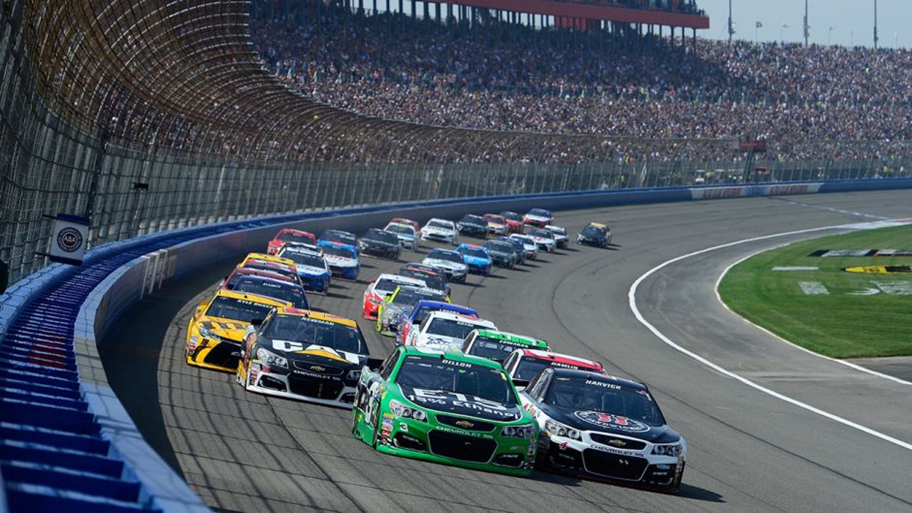 FONTANA, CA - MARCH 20: Austin Dillon, driver of the #3 American Ethanol Chevrolet, and Kevin Harvick, driver of the #4 Jimmy John's Chevrolet, lead a pack of cars at the start of the NASCAR Sprint Cup Series Auto Club 400 at Auto Club Speedway on March 20, 2016 in Fontana, California. (Photo by Robert Laberge/Getty Images)