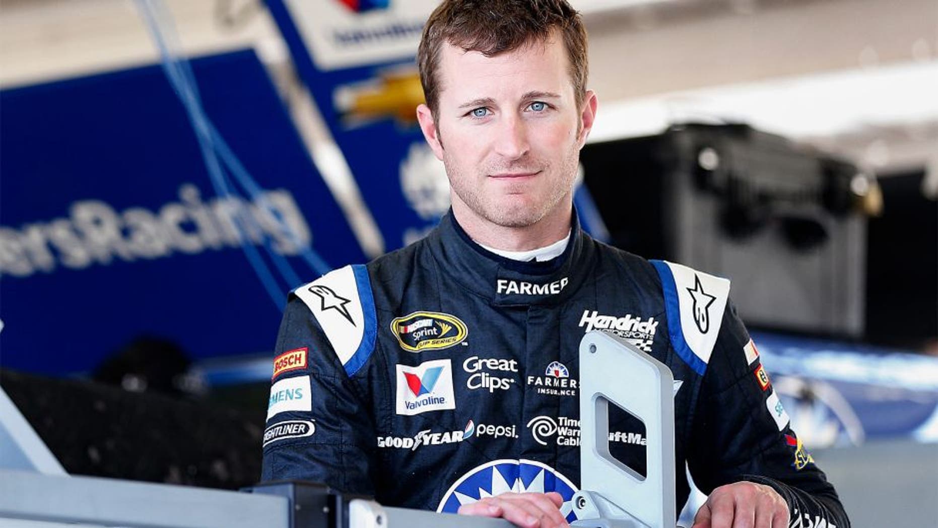 AVONDALE, AZ - NOVEMBER 13: Kasey Kahne, driver of the #5 Farmers Insurance Chevrolet, stands in the garage area during practice for the NASCAR Sprint Cup Series Quicken Loans Race for Heroes 500 at Phoenix International Raceway on November 13, 2015 in Avondale, Arizona. (Photo by Christian Petersen/Getty Images)