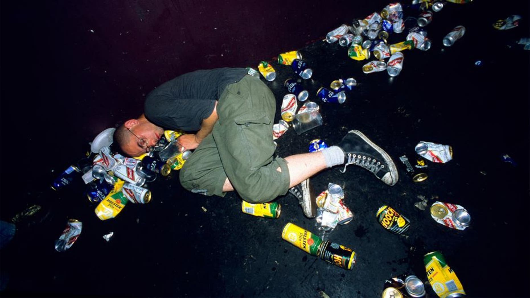 Punk asleep amoungst litter and beer cans on the floor at a gig. London Astoria 1998. (Photo by: PYMCA/UIG via Getty Images)