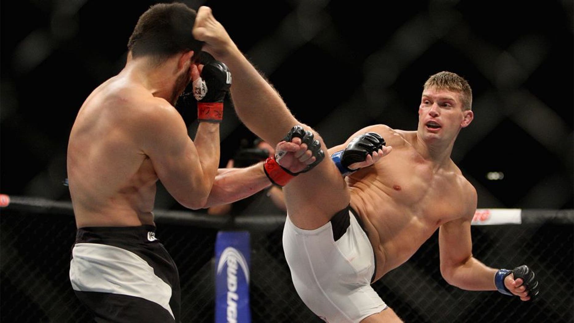 LAS VEGAS, NV - JULY 12: (R-L) Stephen Thompson kicks Jake Ellenberger in their welterweight bout during the Ultimate Fighter Finale inside MGM Grand Garden Arena on July 12, 2015 in Las Vegas, Nevada. (Photo by Mitch Viquez/Zuffa LLC/Zuffa LLC via Getty Images)