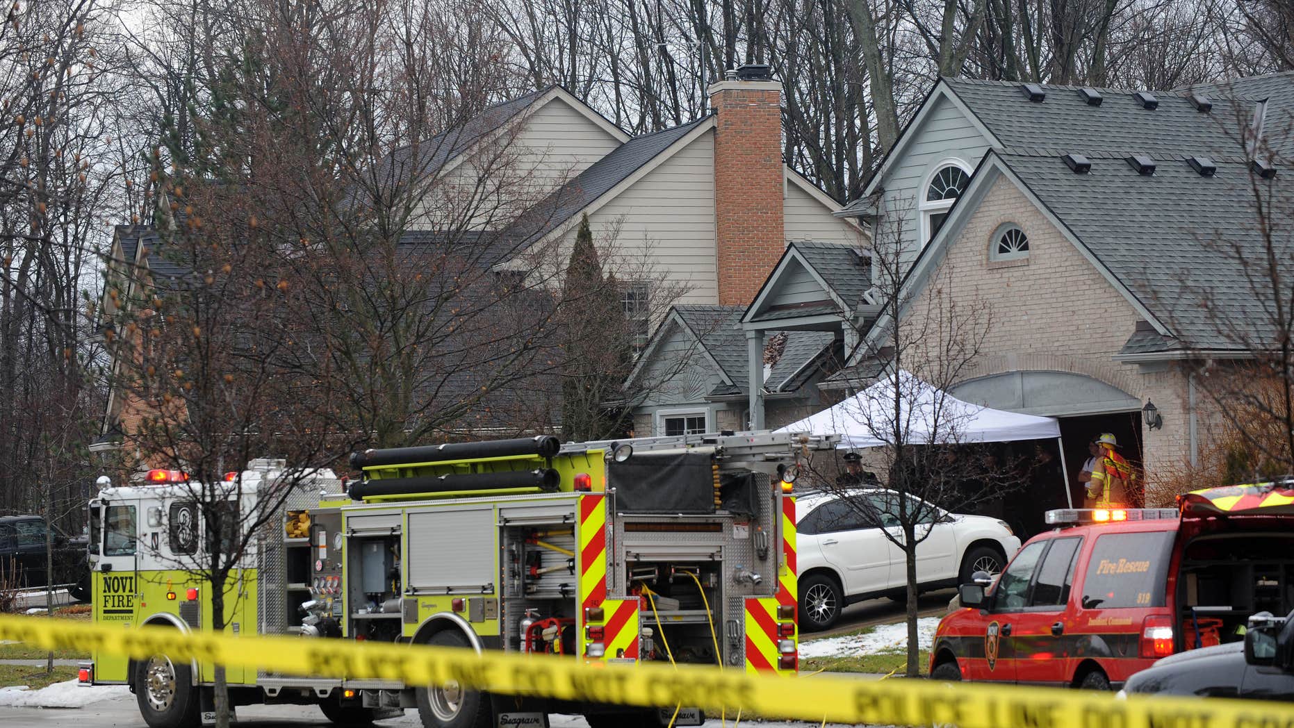 Jan. 31, 2016: Police and fire officials investigate a house fire that killed five people at a home in Novi, Mich.