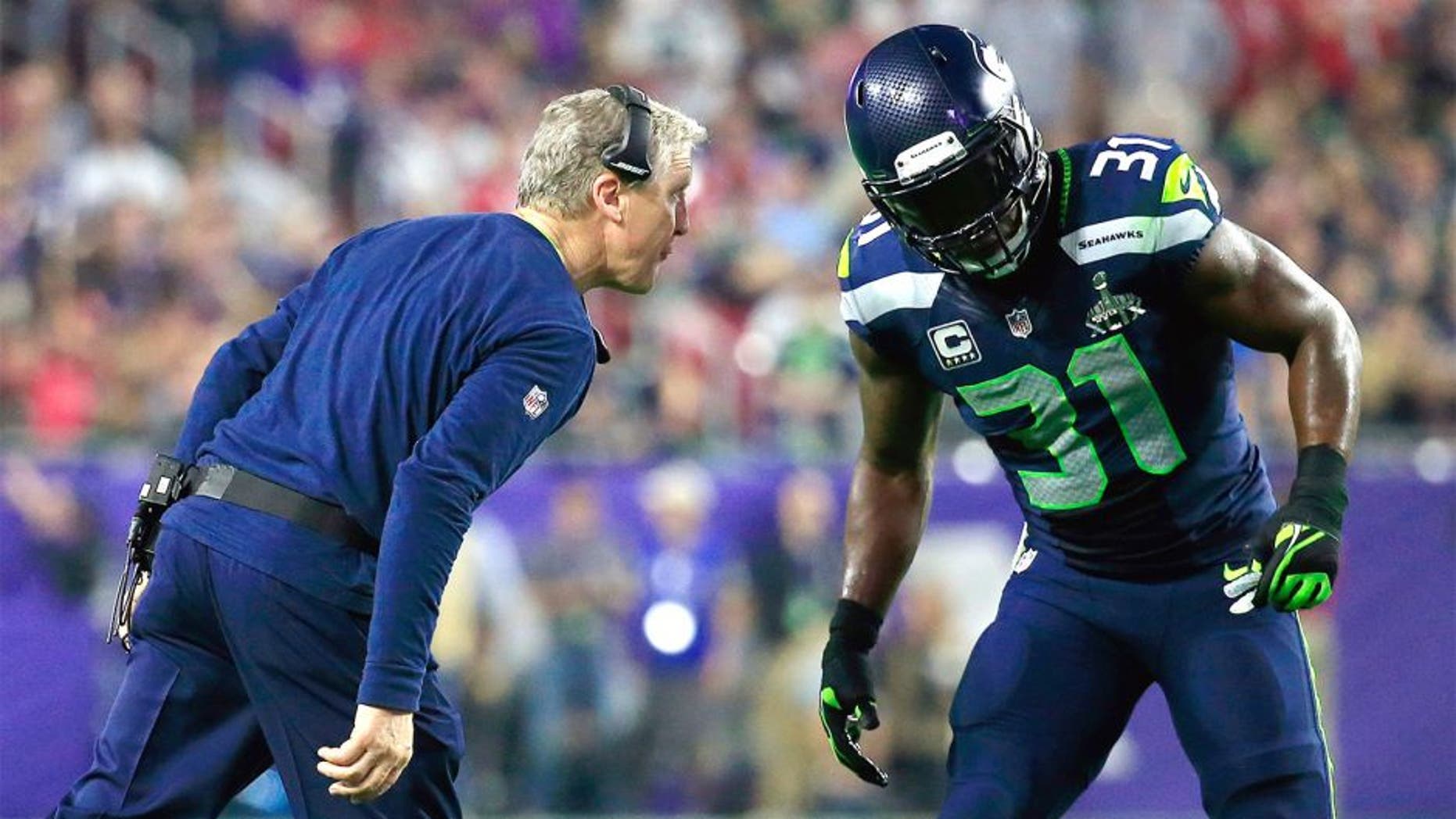 GLENDALE, AZ - FEBRUARY 01: Head coach Pete Carroll of the Seattle Seahawks speaks to Kam Chancellor #31 in the second half against the New England Patriots during Super Bowl XLIX at University of Phoenix Stadium on February 1, 2015 in Glendale, Arizona. (Photo by Rob Carr/Getty Images)