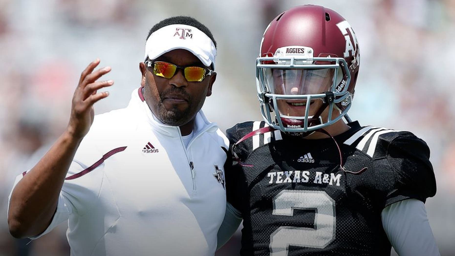 COLLEGE STATION, TX - APRIL 13: Head coach Kevin Sumlin of the Texas A&M Aggies chats with his quarterback Johnny Manziel #2 before the Maroon & White spring football game at Kyle Field on April 13, 2013 in College Station, Texas. (Photo by Scott Halleran/Getty Images)