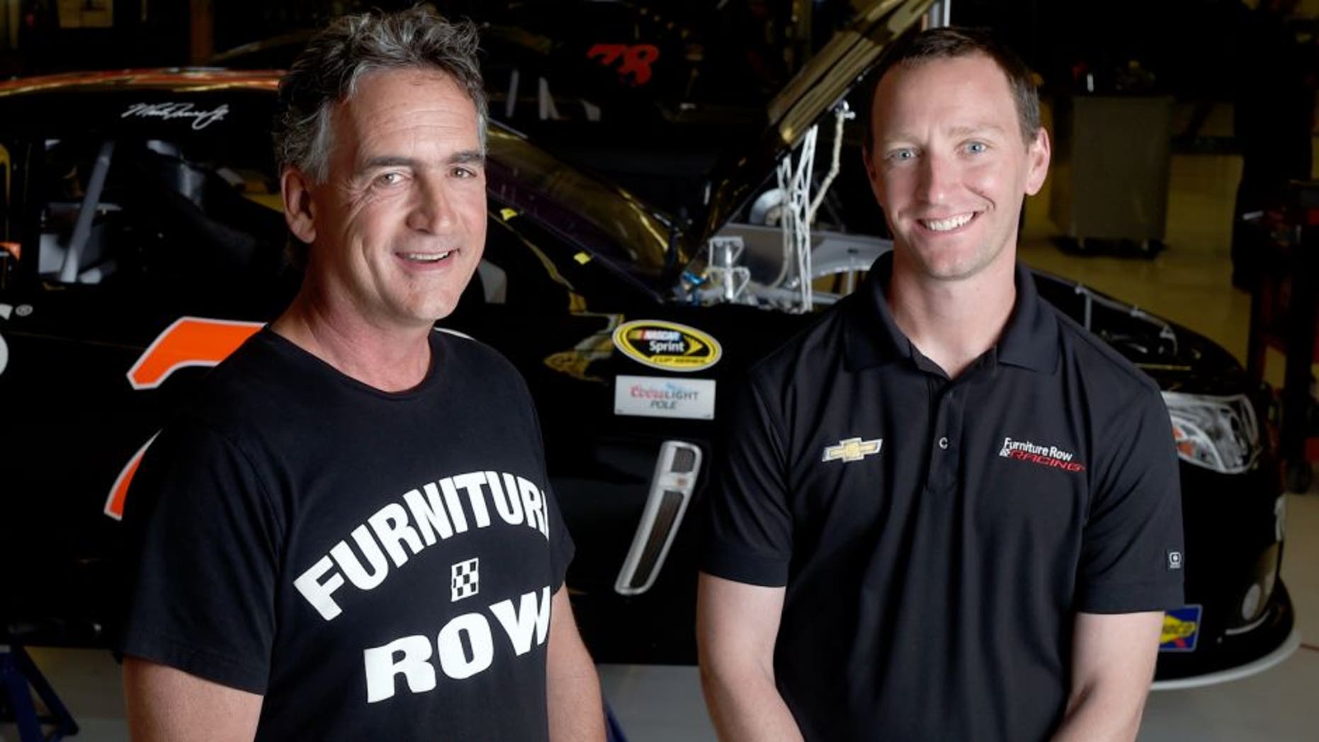 DENVER, CO - JUNE 08: Furniture Row Racing crew chief Cole Pearn (right) and general manager Joe Garone pose at the Furniture Row Racing shop on Monday, June 8, 2015. Team driver Martin Truex Jr. won the Axalta 400 at Pocono Raceway on Sunday. (Photo by AAron Ontiveroz/The Denver Post via Getty Images)