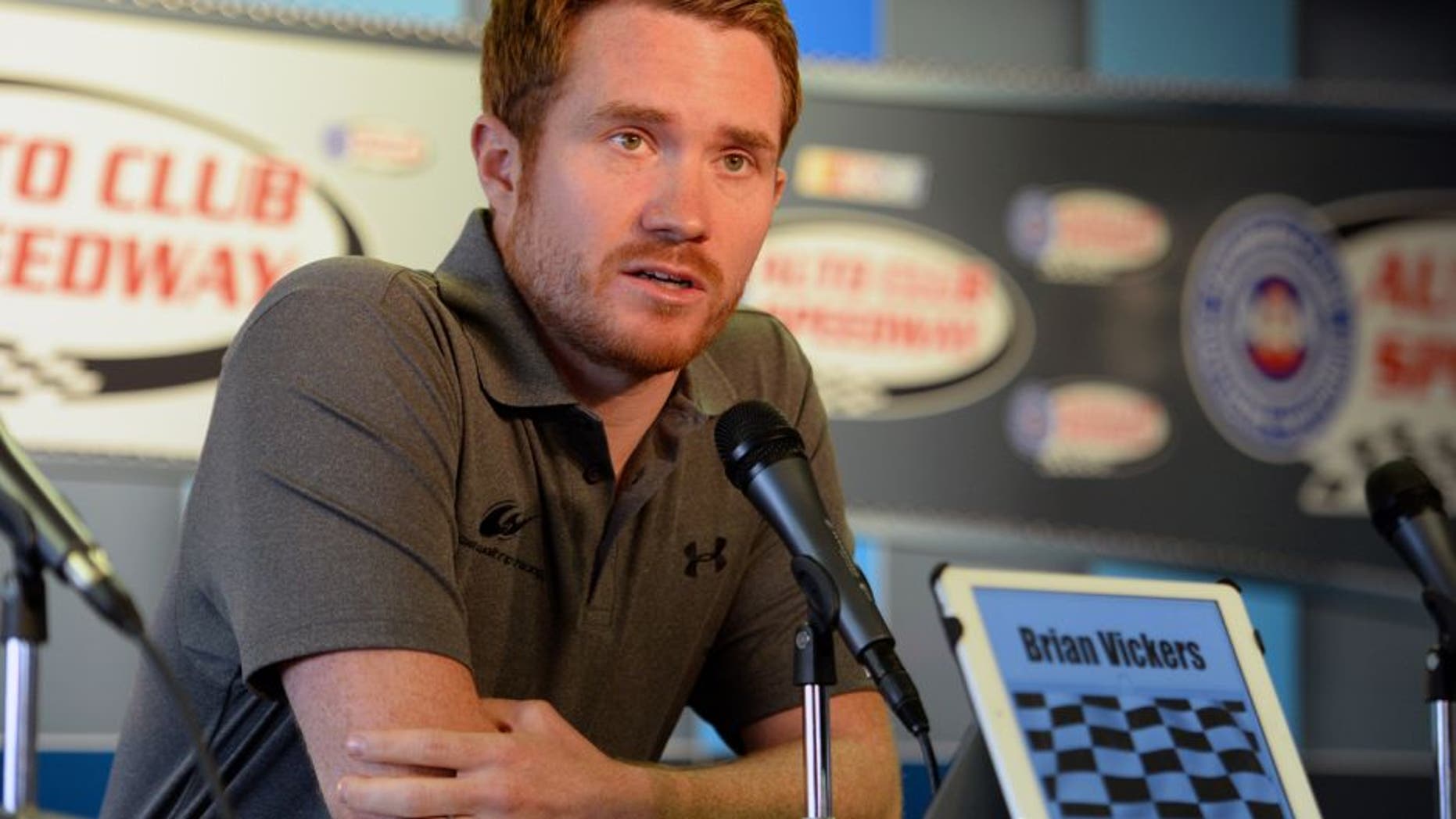 FONTANA, CA - MARCH 22: Brian Vickers, driver of the Michael Waltrip Racing Toyota, answers questions from media during a press conference before the NASCAR Sprint Cup Series Auto Club 400 at Auto Club Speedway on March 22, 2015 in Fontana, California. Vickers was forced to withdraw from competition due to blood clots. (Photo by Robert Laberge/Getty Images)