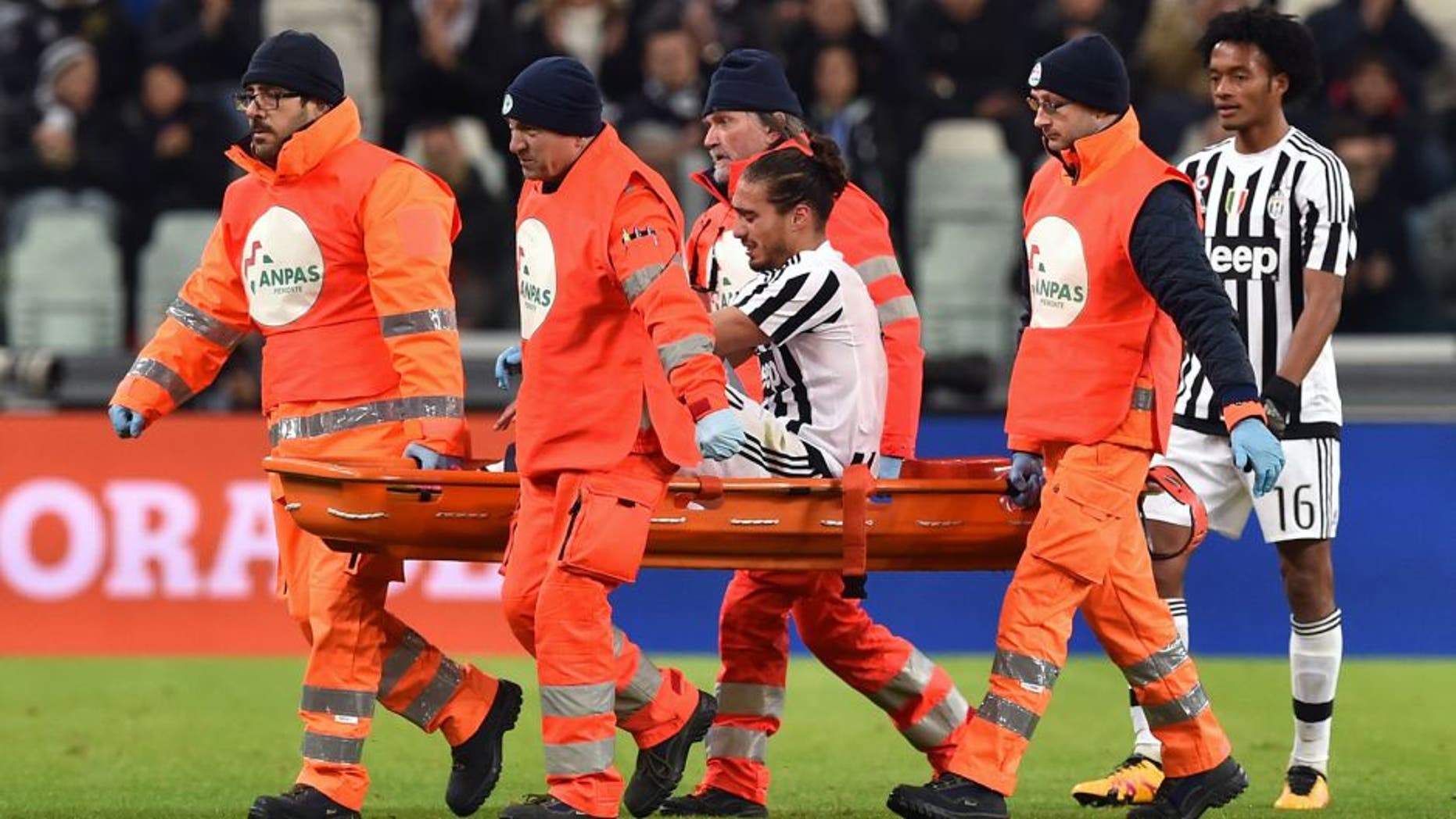 TURIN, ITALY - FEBRUARY 03: Martin Caceres of Juventus FC is helped from the pitch after sustaining an injury during the Serie A match between Juventus FC and Genoa CFC at Juventus Arena on February 3, 2016 in Turin, Italy. (Photo by Valerio Pennicino/Getty Images)