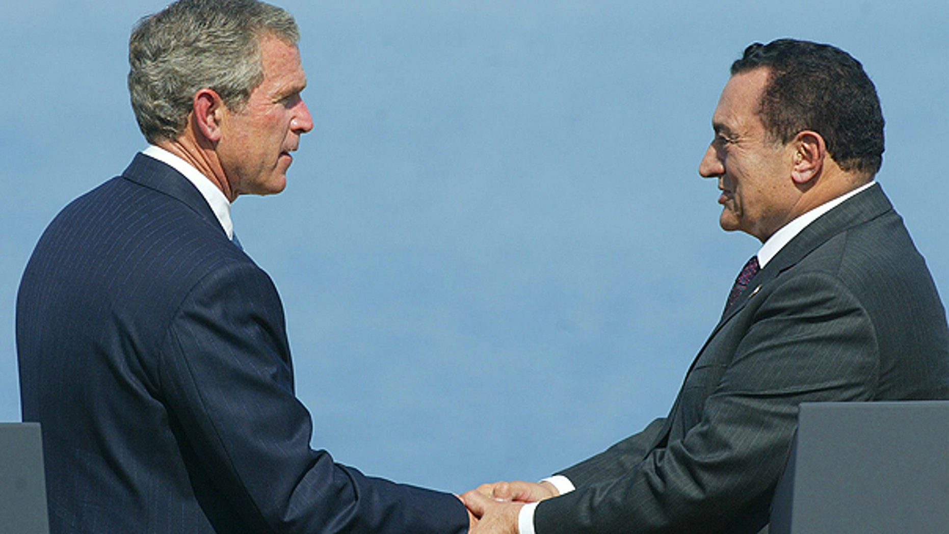 In a June 3, 2003 file photo, U.S. President George W. Bush shakes hands with Egyptian President Hosni Mubarak during the Multilateral Summit in Sharm El-Sheikh, Egypt.