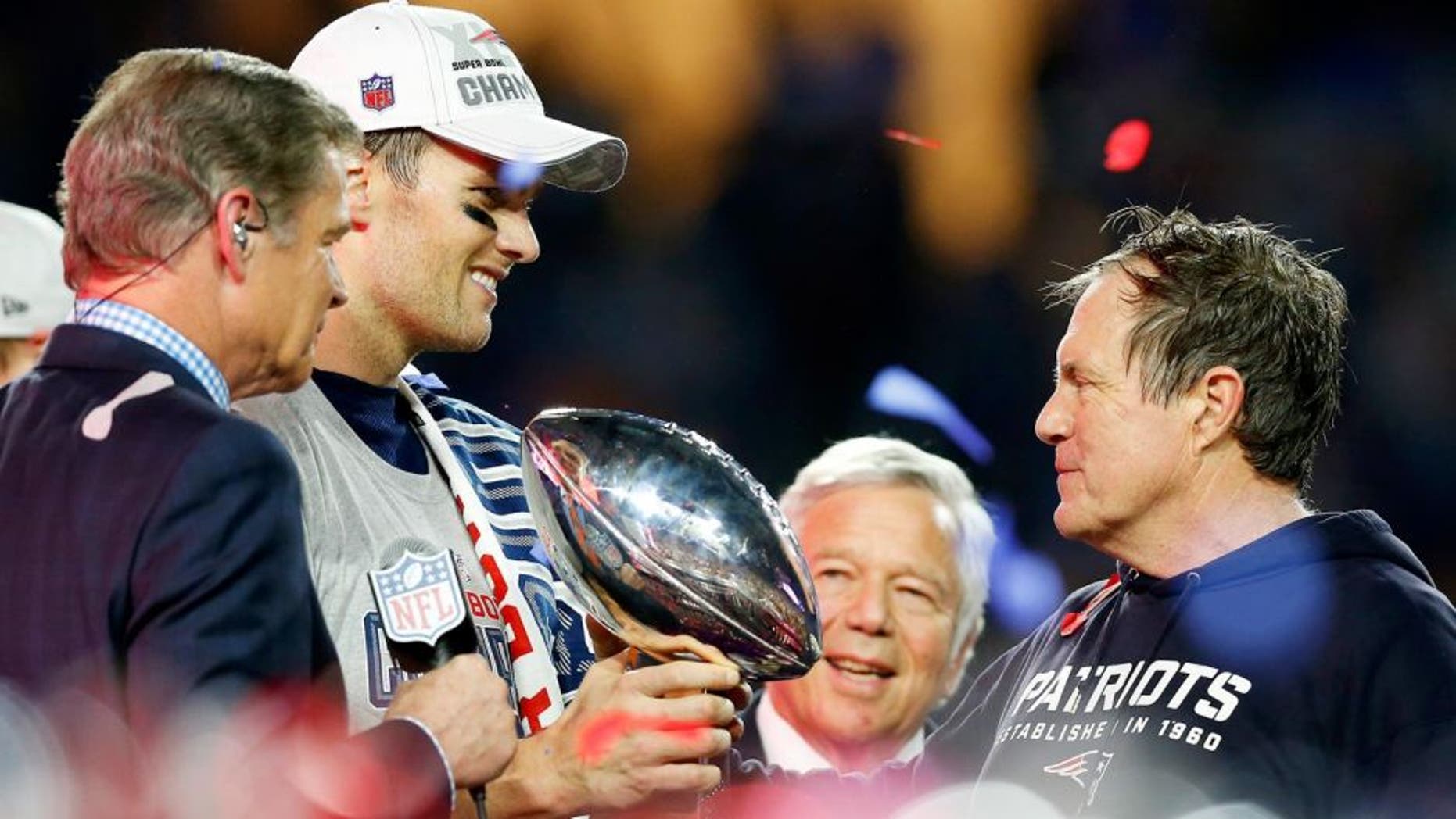 GLENDALE, AZ - FEBRUARY 01: Tom Brady #12, team owner Robert Kraft, and head coach Bill Belichick of the New England Patriots celebrate with the Vince Lombardi Trophy after defeating the Seattle Seahawks 28-24 to win Super Bowl XLIX at University of Phoenix Stadium on February 1, 2015 in Glendale, Arizona. (Photo by Tom Pennington/Getty Images)