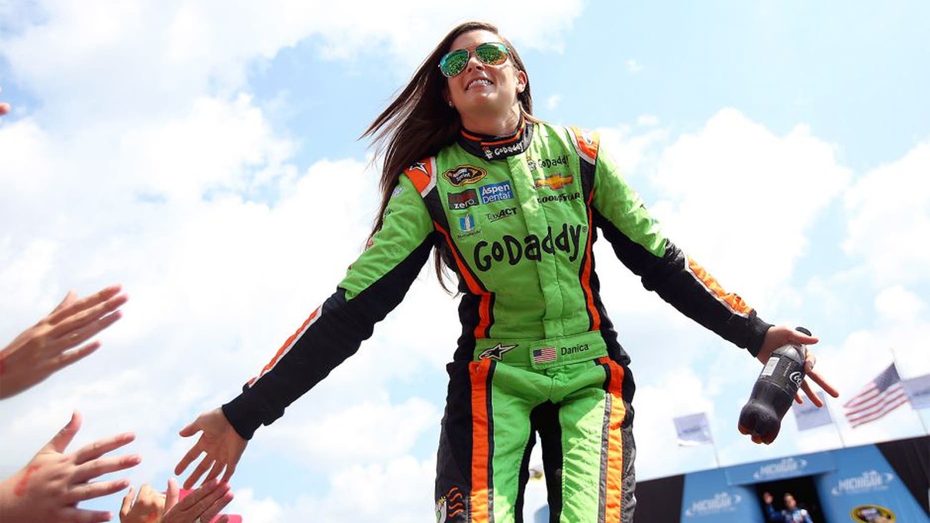 BROOKLYN, MI - AUGUST 16: Danica Patrick, driver of the #10 GoDaddy Chevrolet, is introduced during pre-race ceremonies before the NASCAR Sprint Cup Series Pure Michigan 400 at Michigan International Speedway on August 16, 2015 in Brooklyn, Michigan. (Photo by Nick Laham/NASCAR via Getty Images)