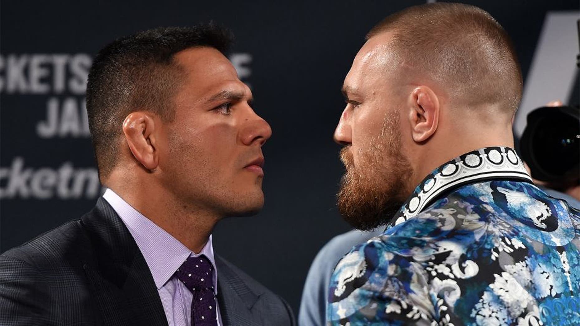 LAS VEGAS, NV - JANUARY 20: Rafael dos Anjos of Brazil (L) and Conor McGregor of Ireland (R) face off during the UFC 197 on-sale press conference event inside MGM Grand Hotel & Casino on January 20, 2016 in Las Vegas, Nevada. (Photo by Jeff Bottari/Zuffa LLC/Zuffa LLC via Getty Images)