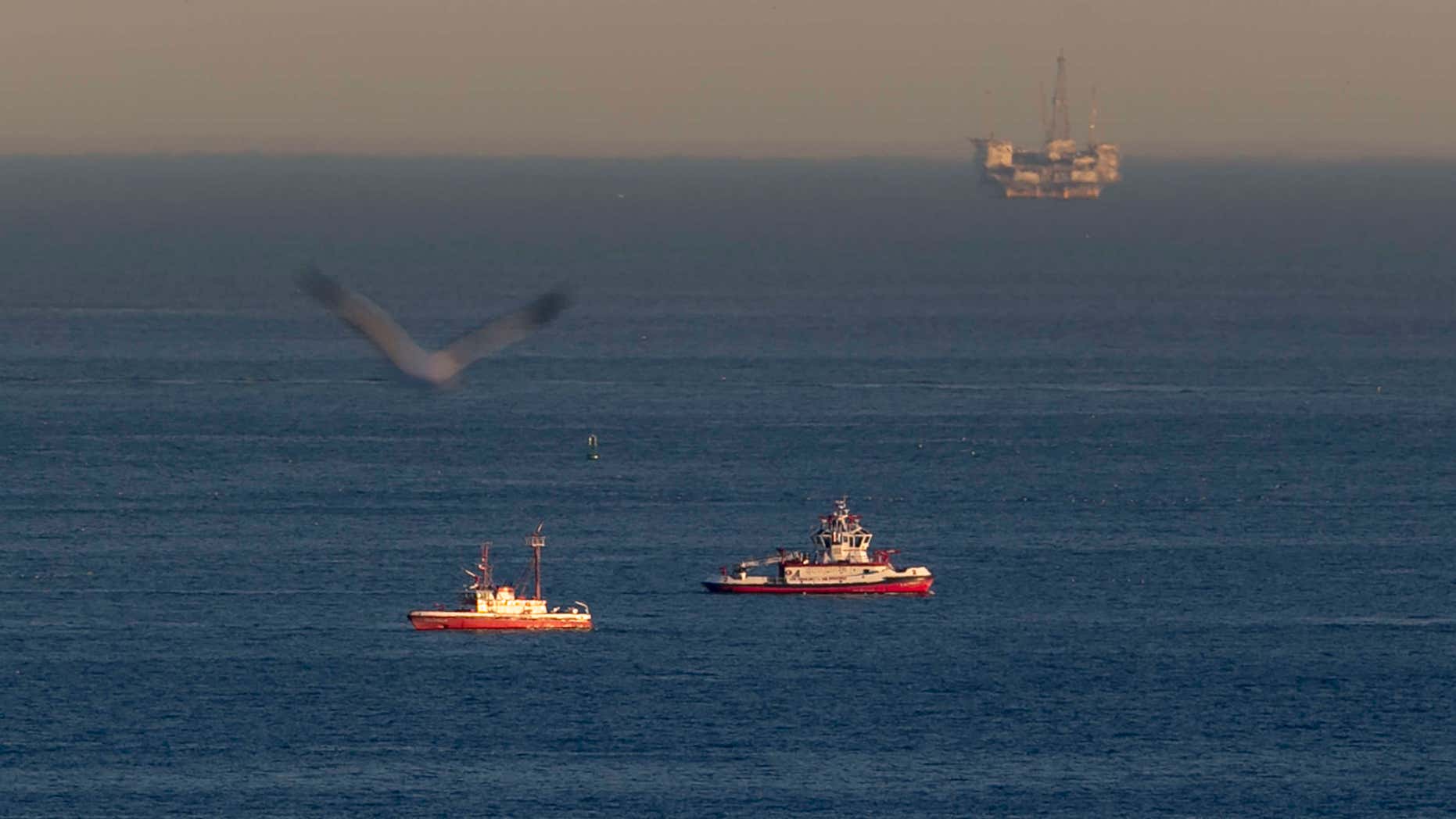 Feb. 5, 2016: Rescue boats search for wreckage from two small planes that collided in midair and plunged into the ocean off of Los Angeles harbor in San Pedro, Calif.