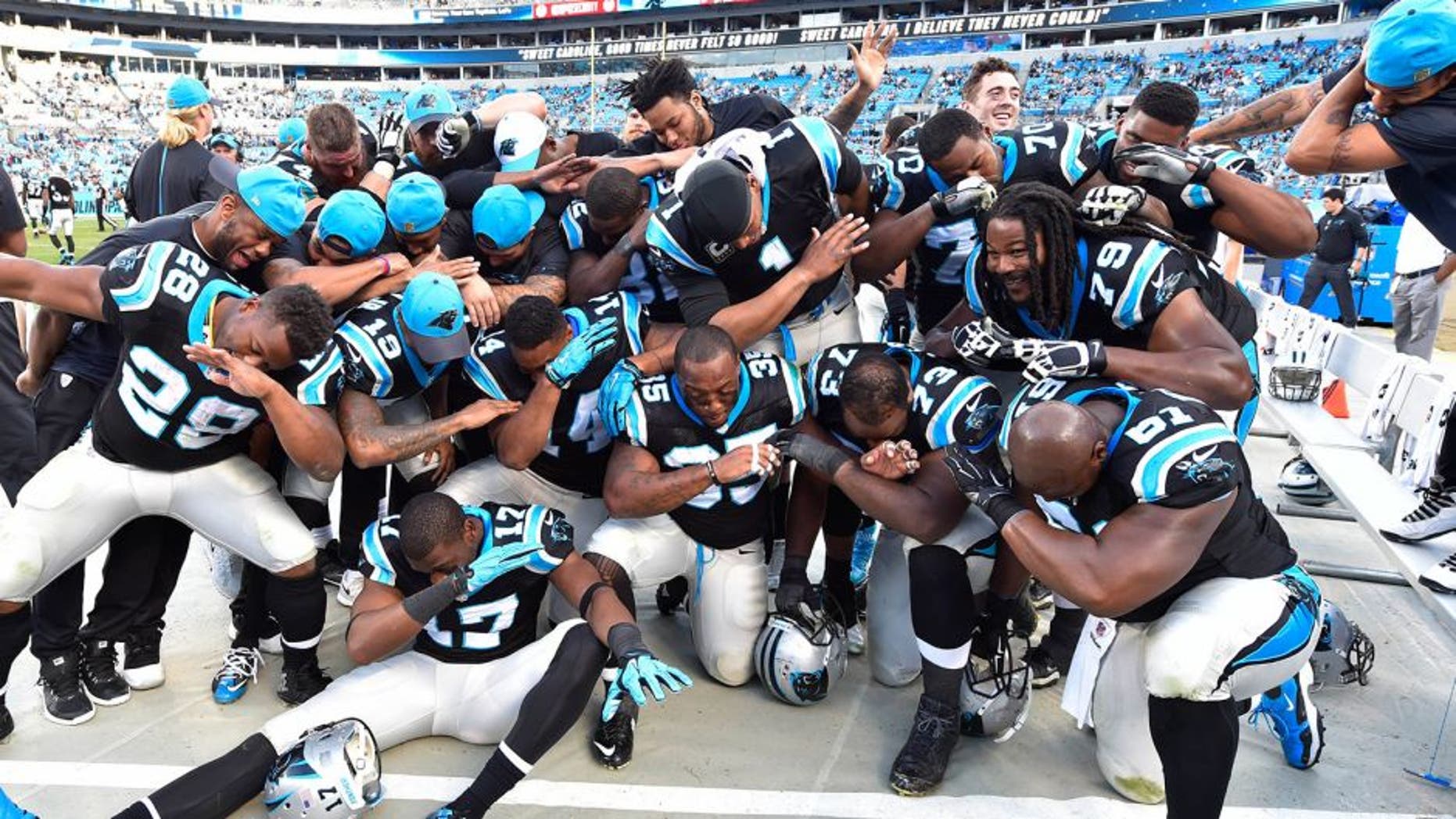 Dec 13, 2015; Charlotte, NC, USA; Carolina Panthers dab late in the game. The Panthers defeated the Falcons 38-0 at Bank of America Stadium. Mandatory Credit: Bob Donnan-USA TODAY Sports