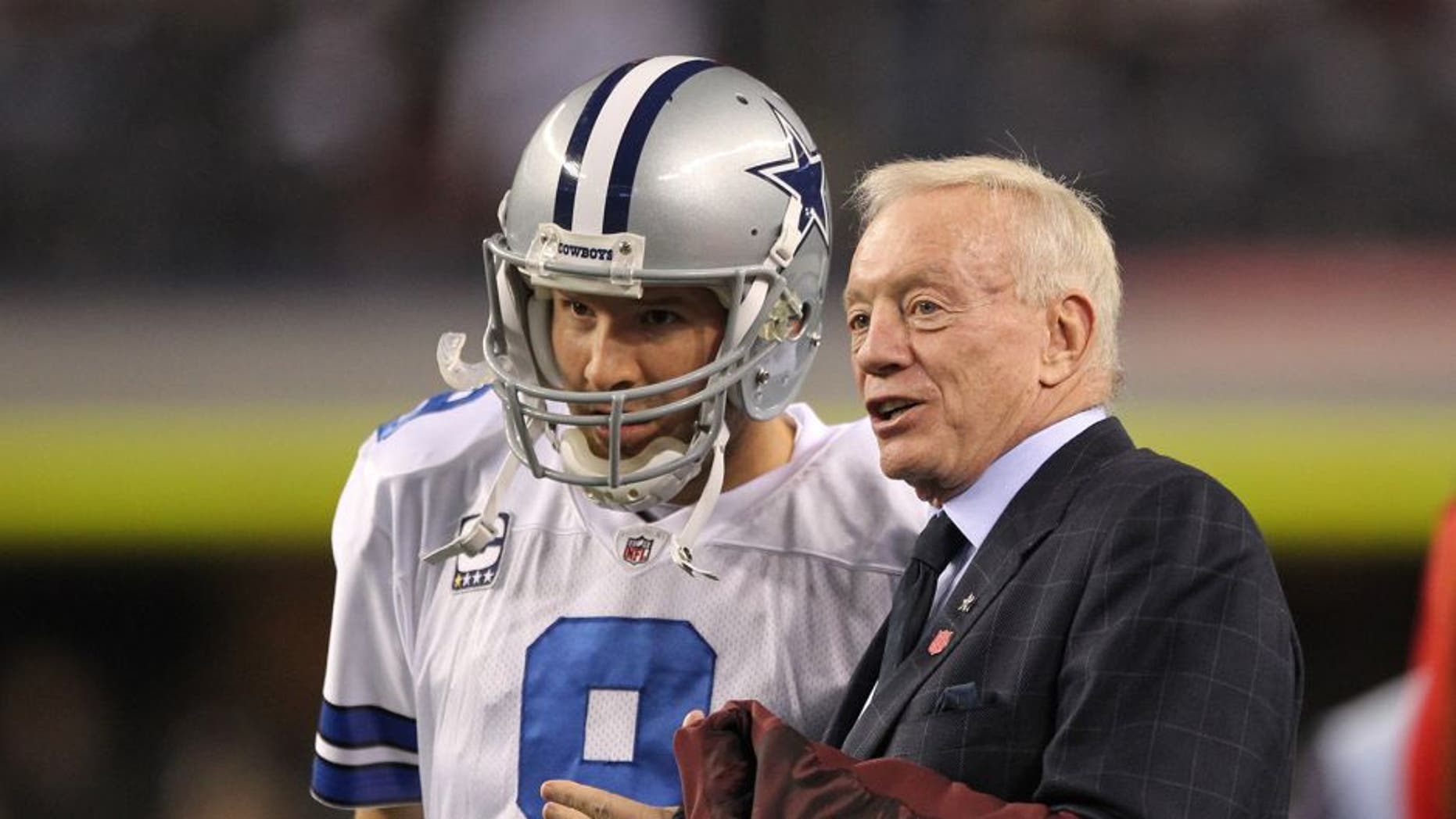 Dec 11, 2011; Dallas, TX, USA; Dallas Cowboys quarterback Tony Romo (9) meets with owner Jerry Jones prior to the game against the New York Giants at Cowboys Stadium. Mandatory Credit: Richard Rowe-USA TODAY Sports