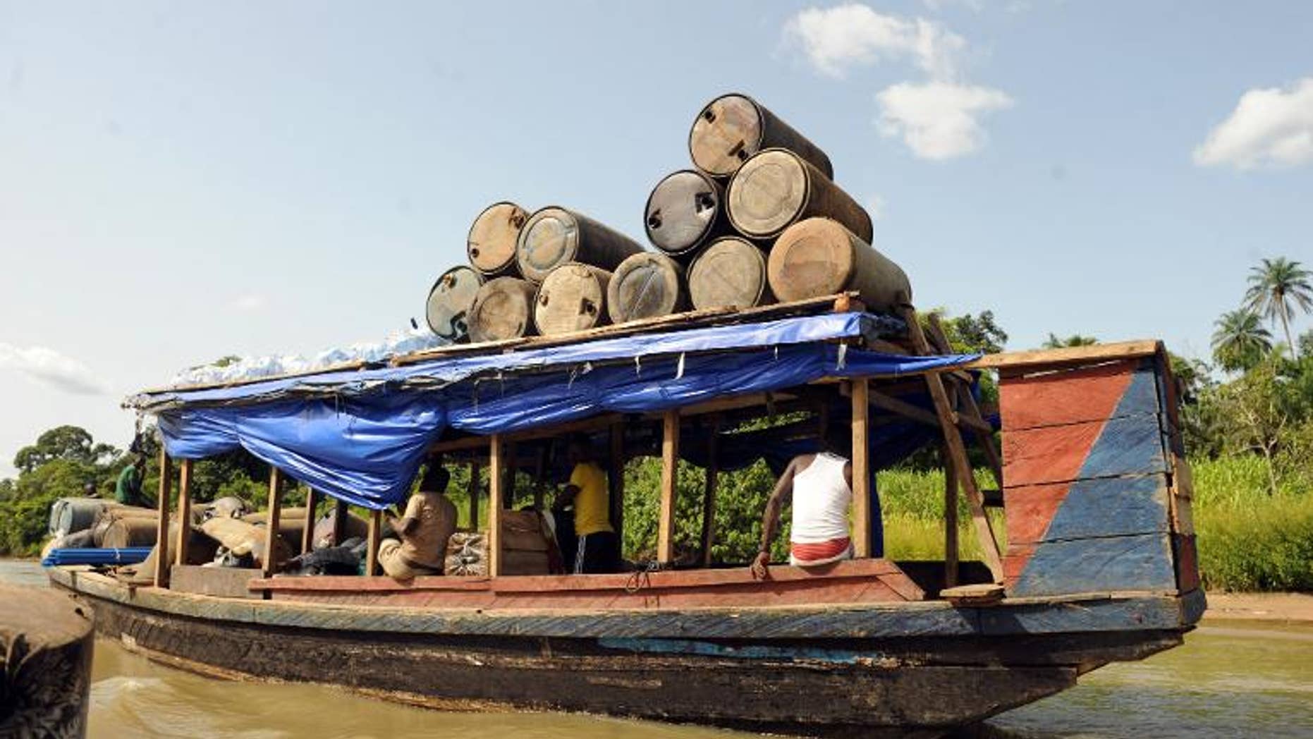 Jerry cans are ferried to the market in Bayelsa State of Niger Delta on April 11, 2013