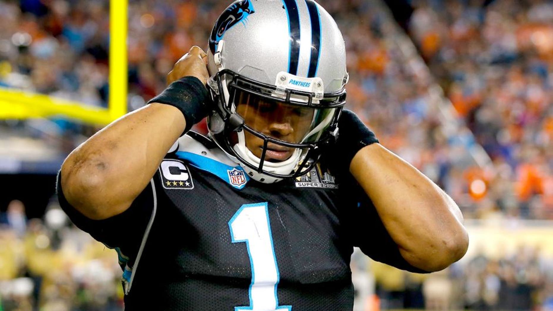 SANTA CLARA, CA - FEBRUARY 07: Cam Newton #1 of the Carolina Panthers reacts after being hit in the fourth quarter of Super Bowl 50 against the Denver Broncos at Levi's Stadium on February 7, 2016 in Santa Clara, California. (Photo by Kevin C. Cox/Getty Images)