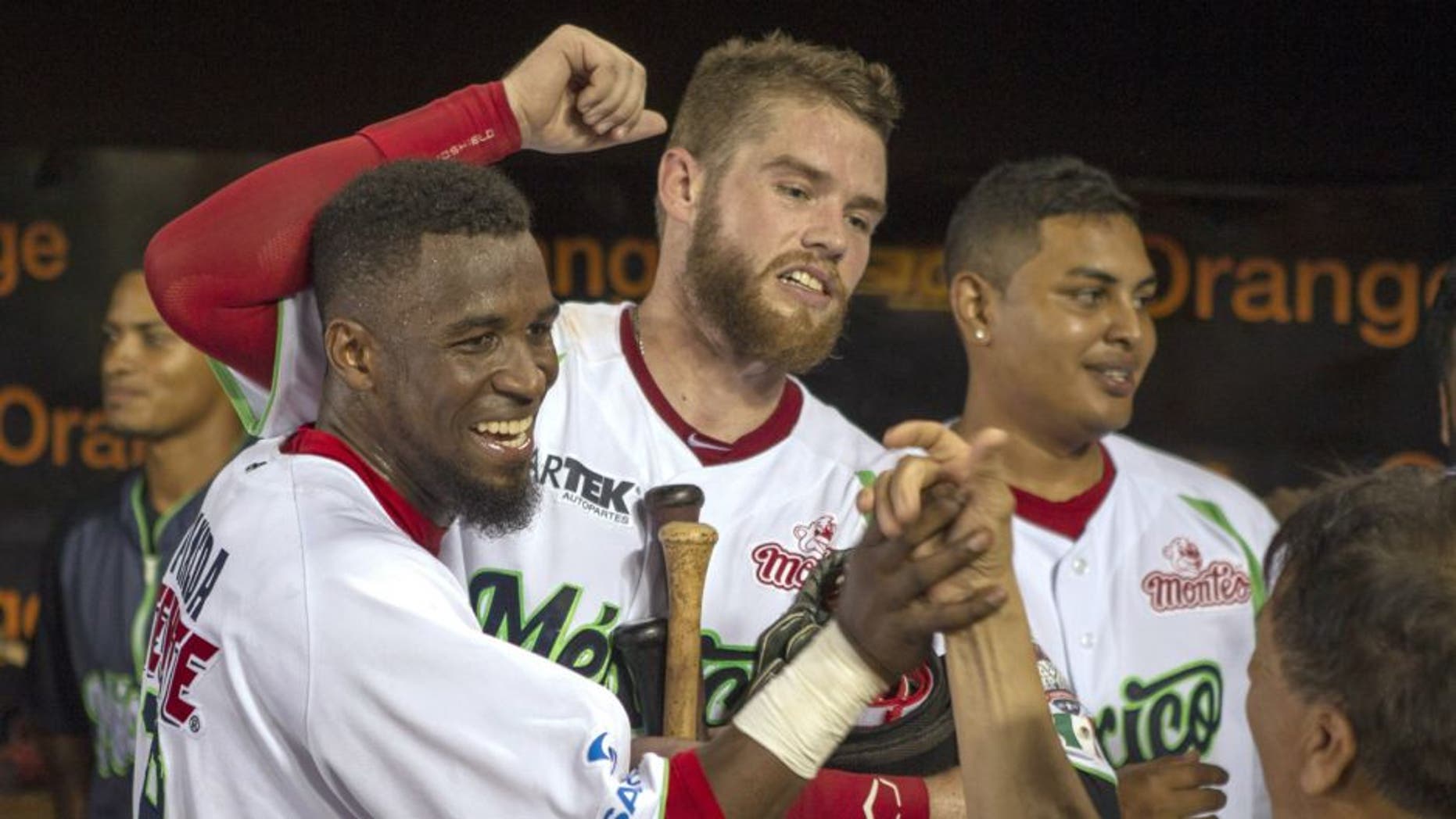 Mexico teammates celebrate after defeating Venezuela in the final game of the 2016 Caribbean baseball series in Santo Domingo, Dominican Republic, on February 7, 2016. AFP PHOTO/ERIKA SANTELICES / AFP / ERIKA SANTELICES (Photo credit should read ERIKA SANTELICES/AFP/Getty Images)