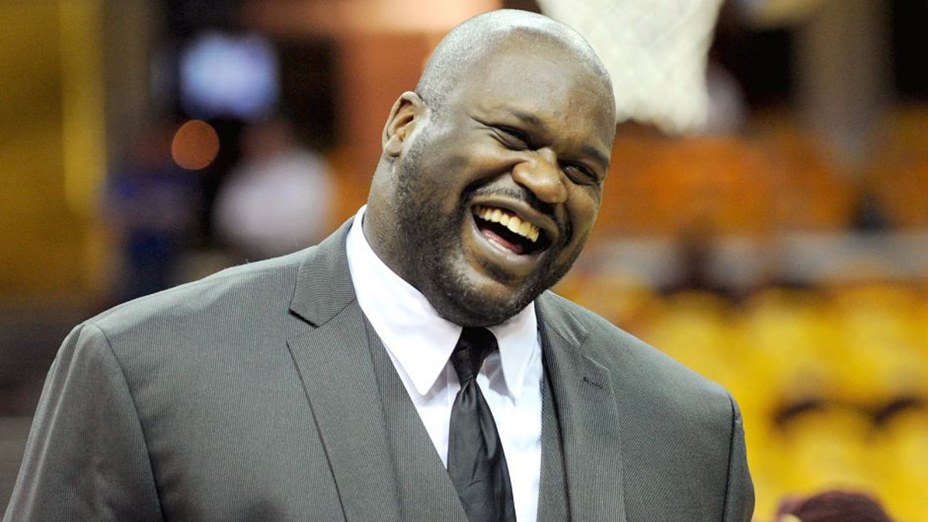 May 26, 2015; Cleveland, OH, USA; TNT analyst Shaquille O'Neal laughs on the court before game four of the Eastern Conference Finals of the NBA Playoffs between the Cleveland Cavaliers and the Atlanta Hawks at Quicken Loans Arena. Mandatory Credit: Ken Blaze-USA TODAY Sports