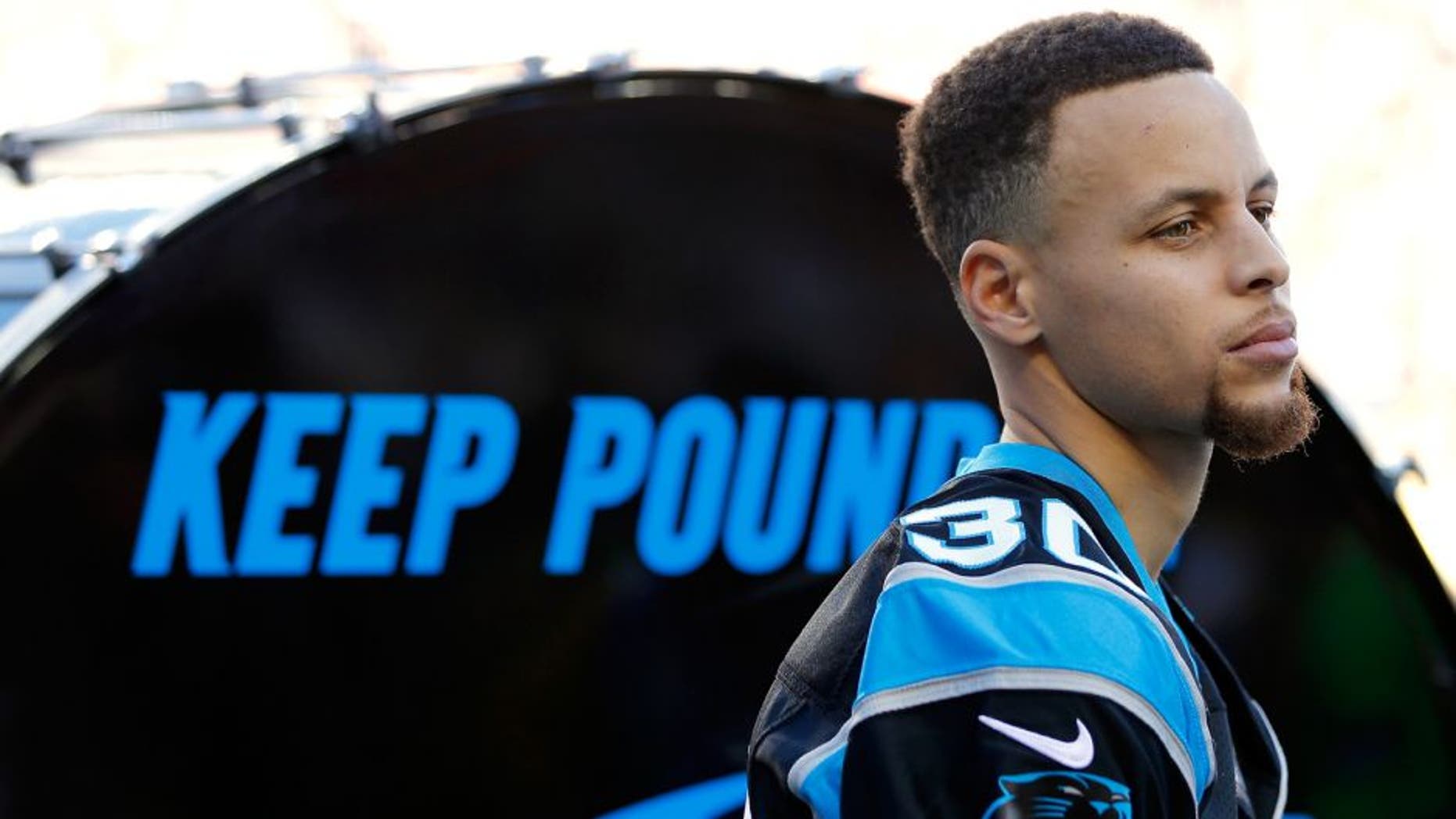 SANTA CLARA, CA - FEBRUARY 07: Stephen Curry of the Golden State Warriors prepares to hit the "Keep Pounding" drum for the Carolina Panthers prior to Super Bowl 50 against the Denver Broncos at Levi's Stadium on February 7, 2016 in Santa Clara, California. (Photo by Kevin C. Cox/Getty Images)