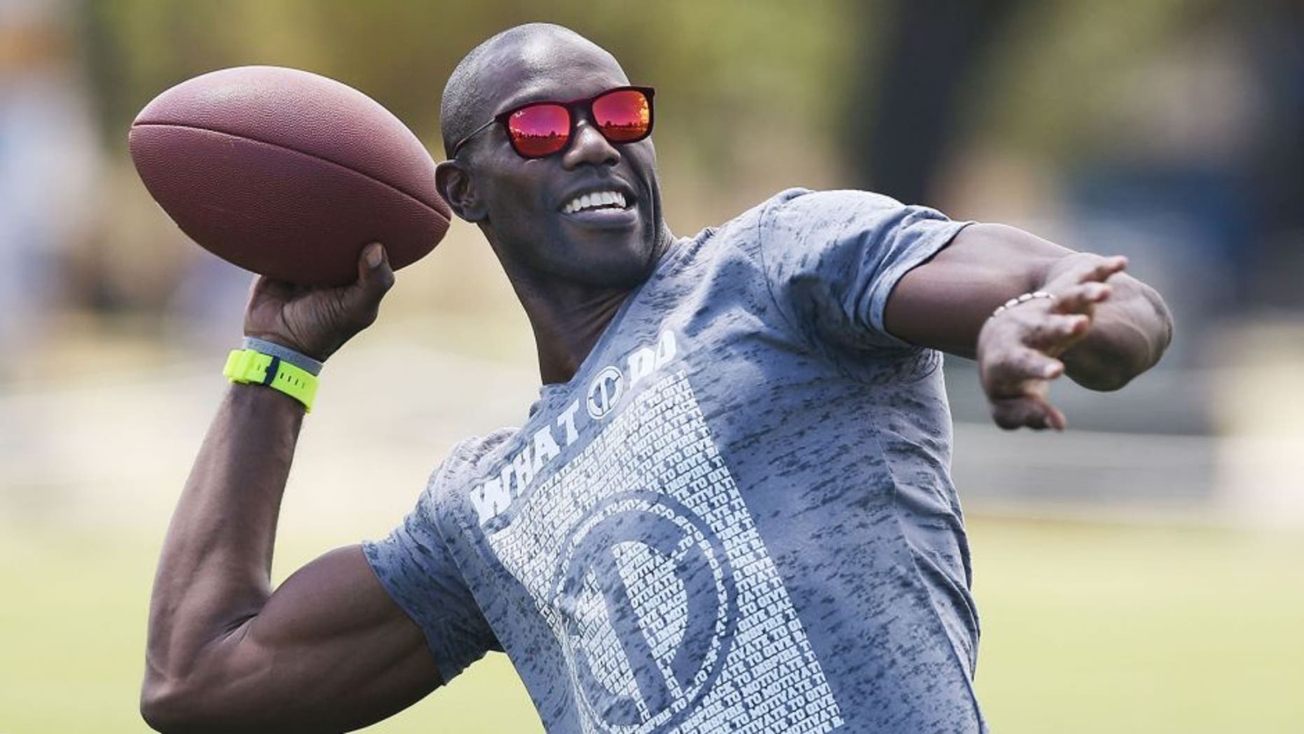 MELBOURNE, AUSTRALIA - JANUARY 30: Former NFL star Terrell Owens throws a gridiron ball during a Hawthorn Hawks AFL media opportunity at Gosch's Paddock on January 30, 2015 in Melbourne, Australia. The Hawks hosted former NFL star Terrell Owens who is in town for the Ultimate Aussie Super Bowl Party in Docklands. (Photo by Michael Dodge/Getty Images)